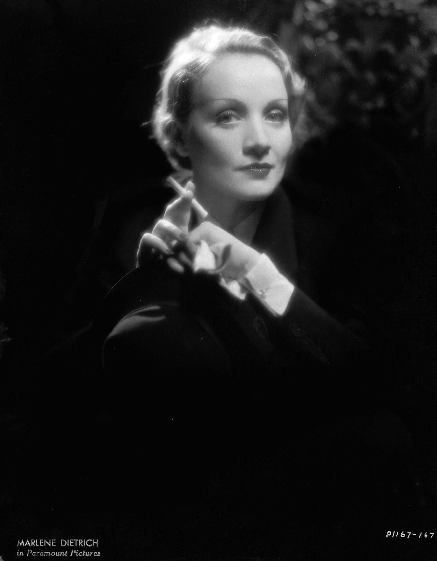 A photograph of Marlene Dietrich smoking.