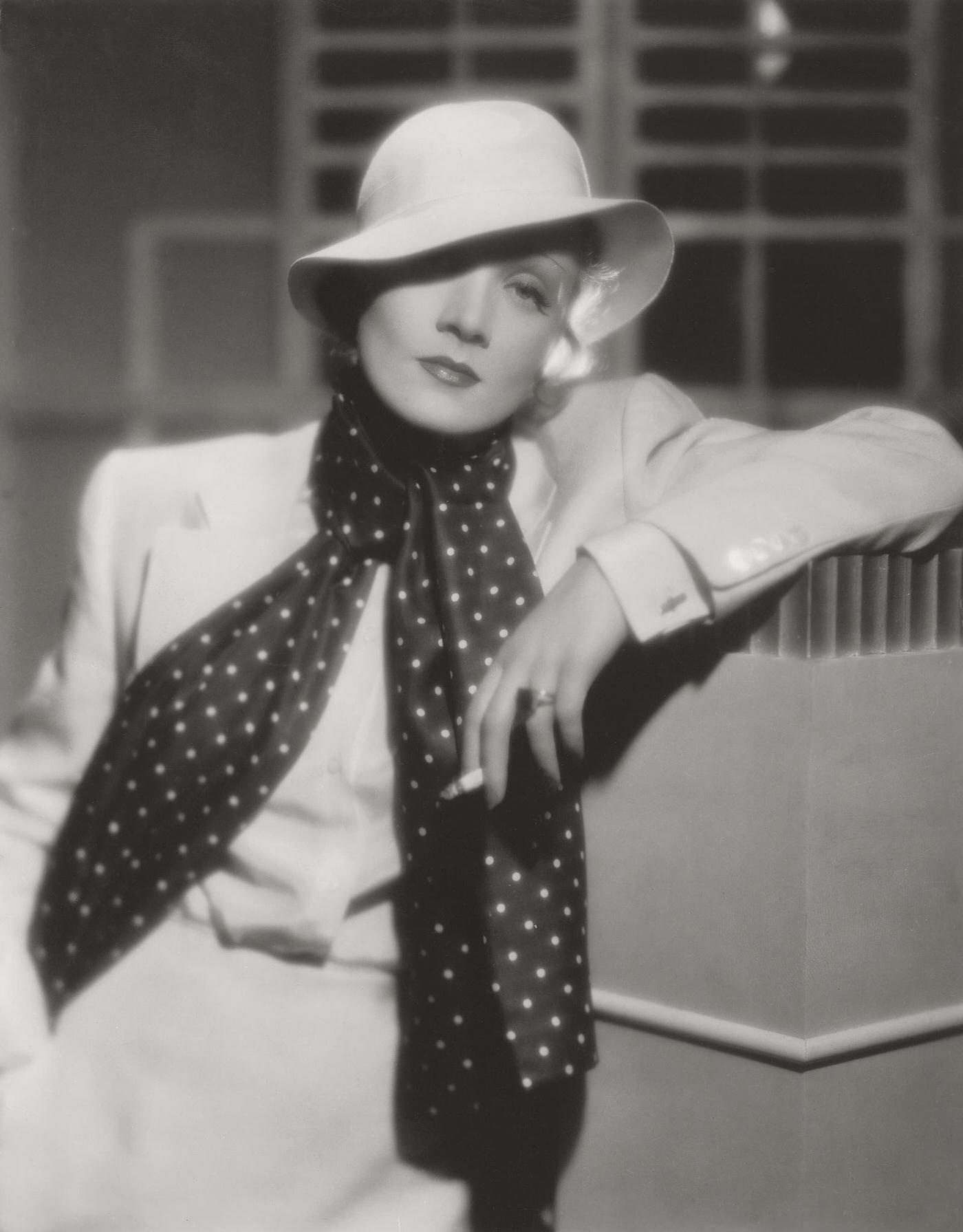 A photograph of Marlene Dietrich smoking taken in 1934.