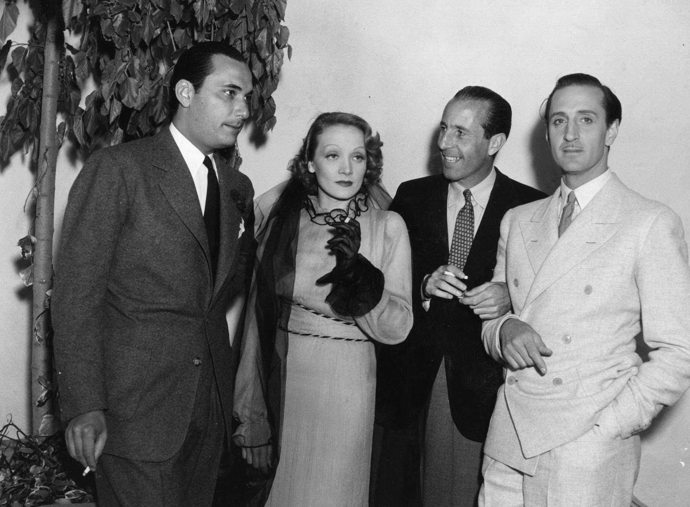 Basil Rathbone meets fellow film star Marlene Dietrich.