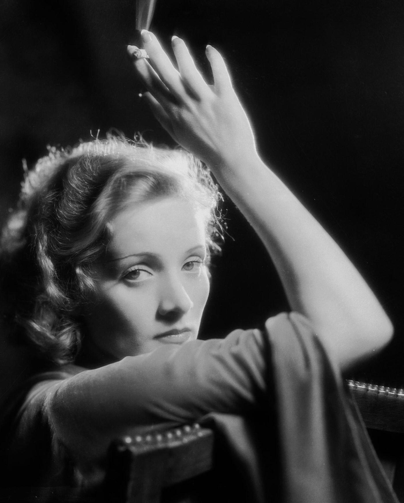 A photograph of Marlene Dietrich smoking.