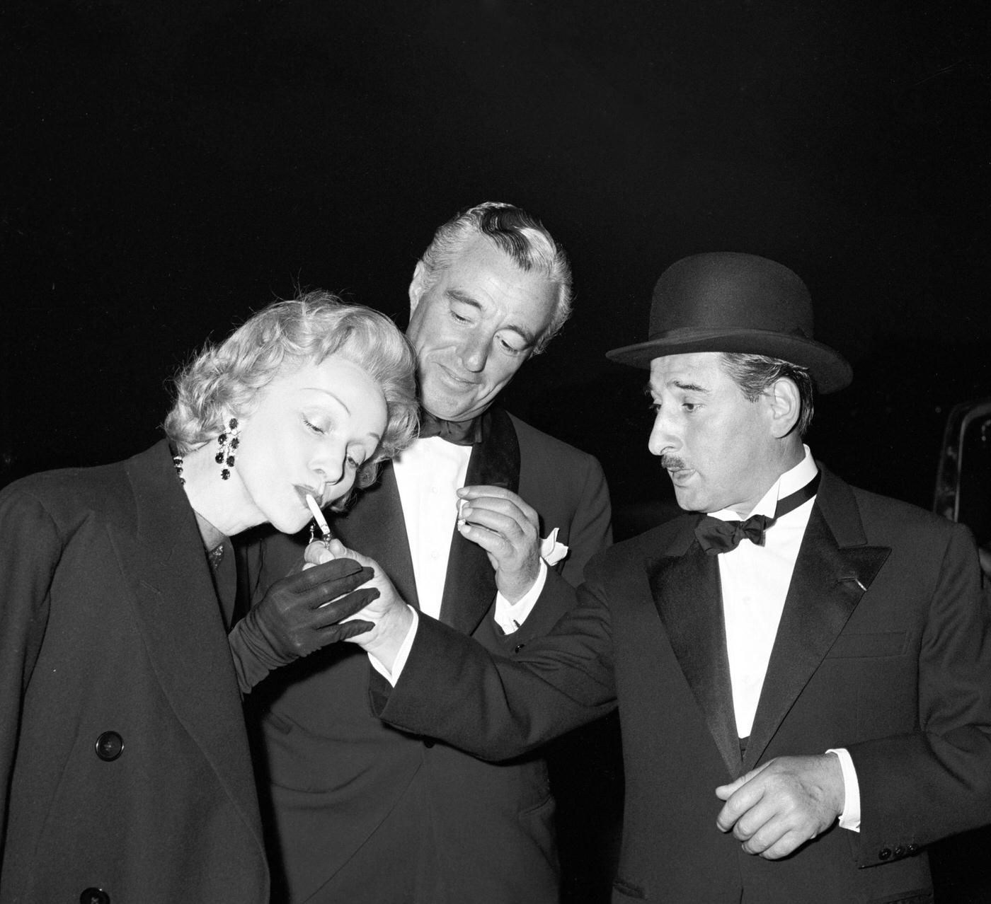 Renato Rascel, Vittorio De Sica, and Marlene Dietrich are pictured on the set of 'The Monte Carlo Story.'