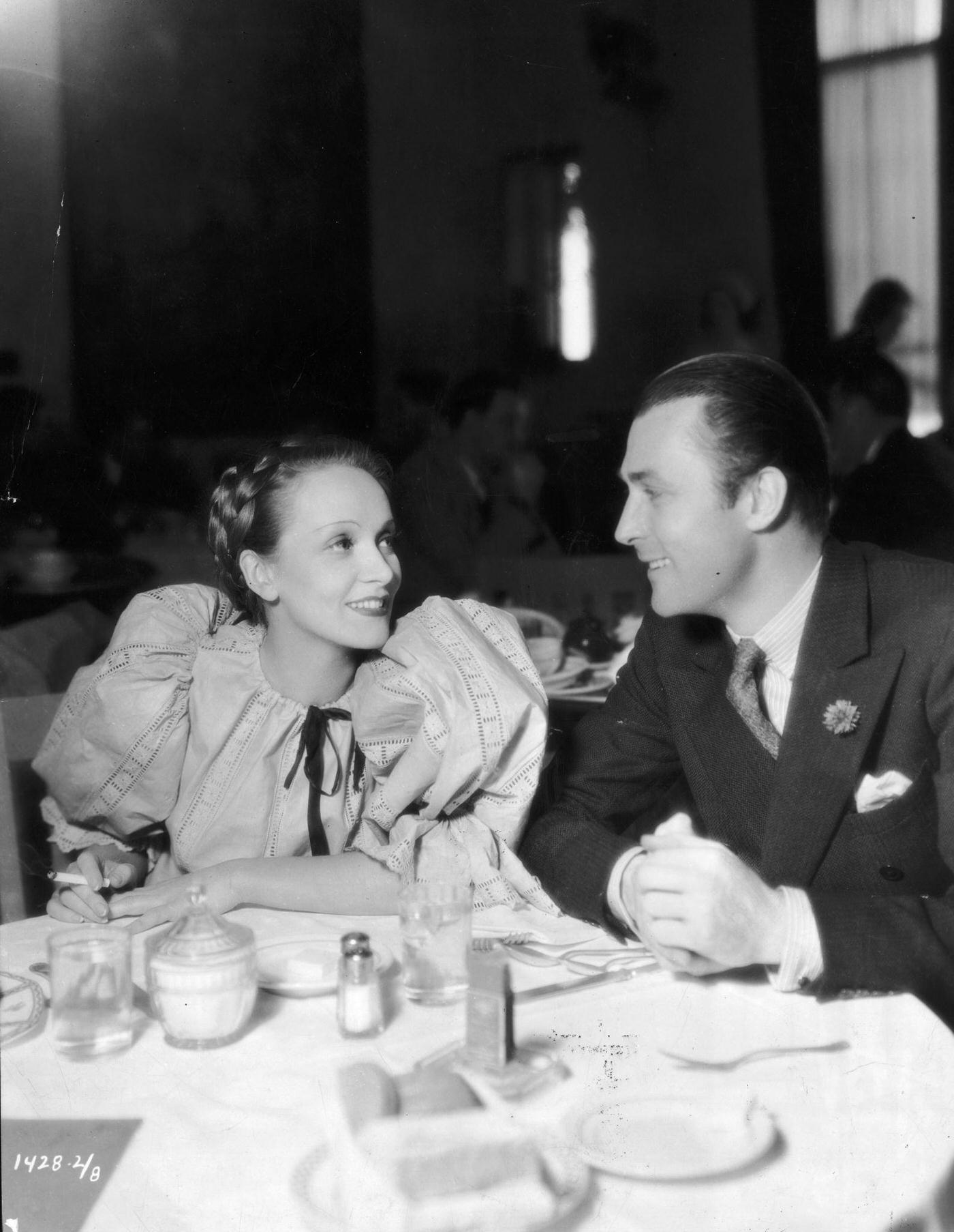 Marlene Dietrich and Brian Aherne share a dinner scene from the film 'Song Of Songs.'