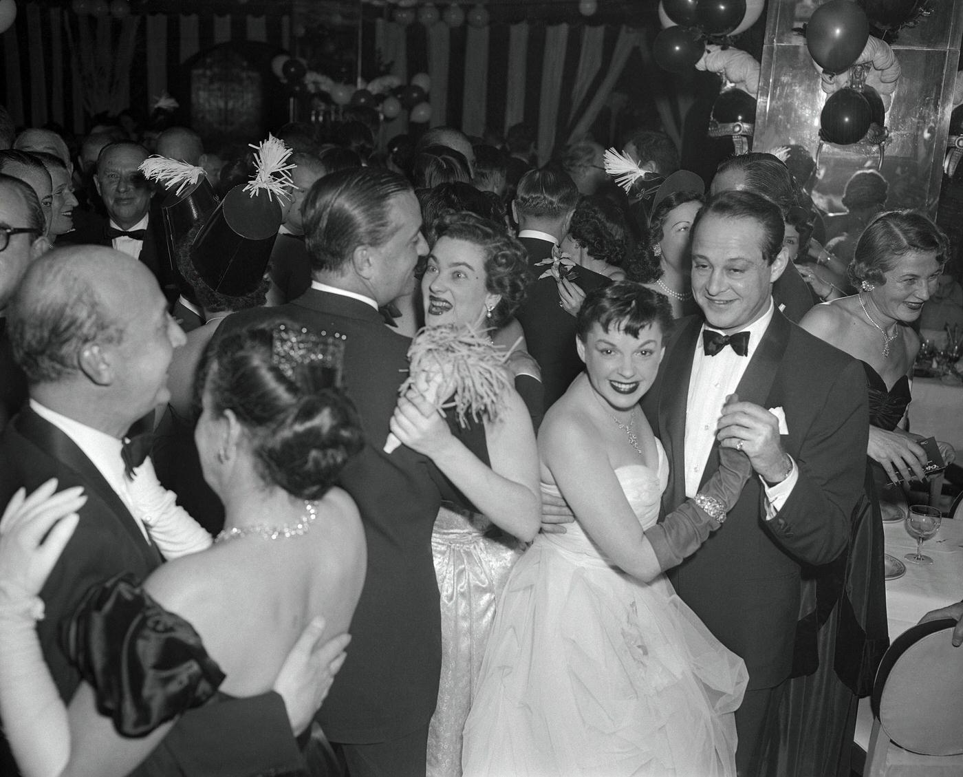 Judy Garland is shown here dancing with Sidney Luft at the Sherry Netherlands Hotel.