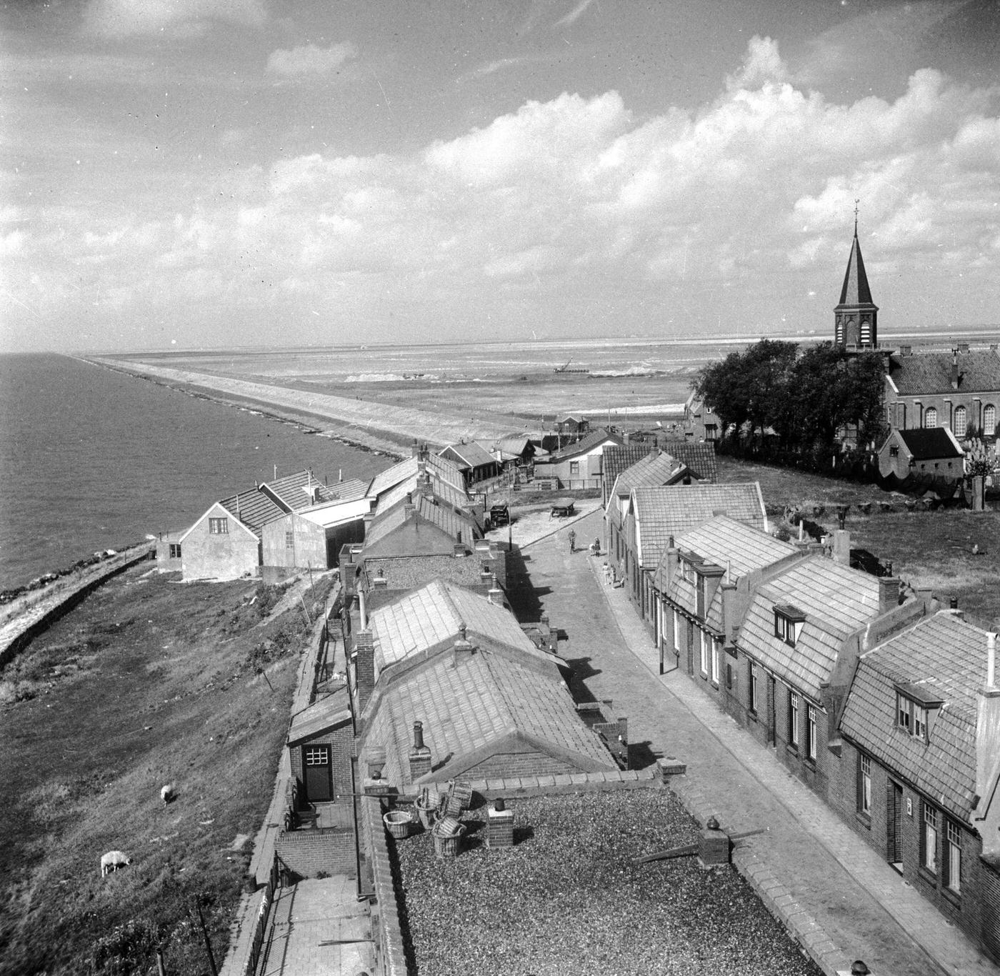 Land stretching to the south of the Afsluitdijk, one of Holland's busiest roads. The land, the Zuider Zee, was once a vast freshwater lake, now a fertile plain.