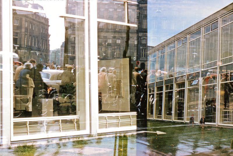 Royal Palace at Dam Square and the facade of the Stedelijk Museum.