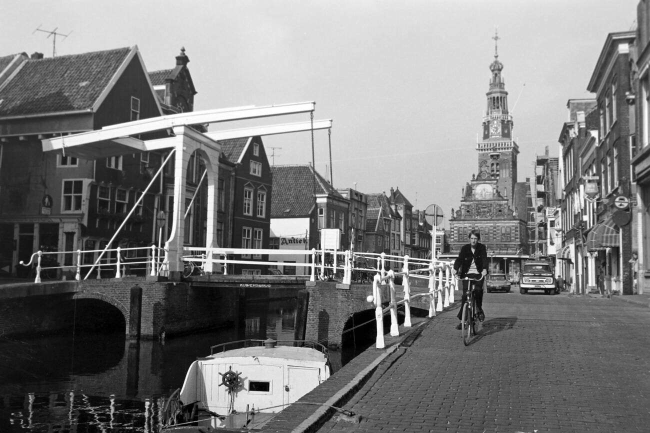 Drawbridge over a canal in Alkmaar with the city weigh building De Waag in the background, The Netherlands in 1971