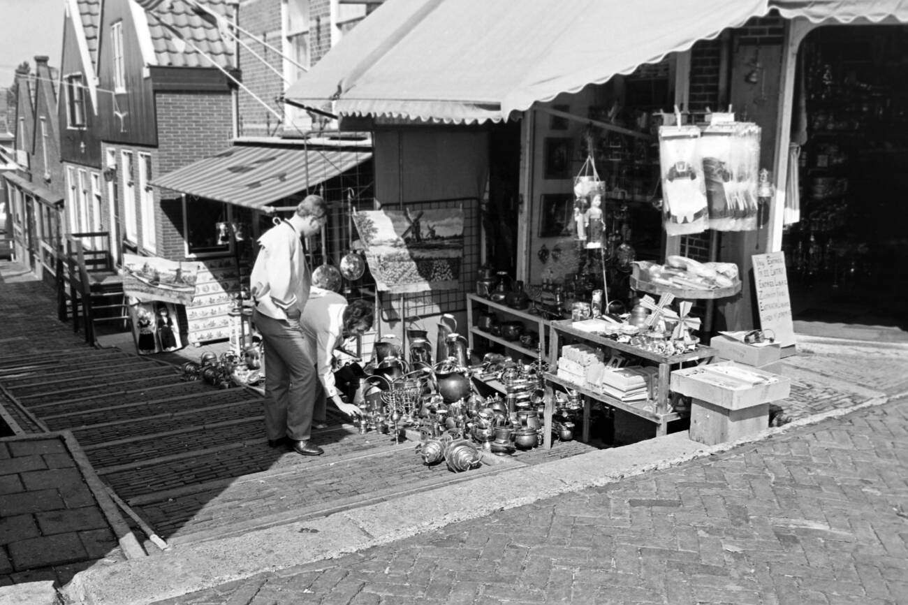 Tourists browsing through the offerings of an antique shop in Volendam, The Netherlands, in 1971.