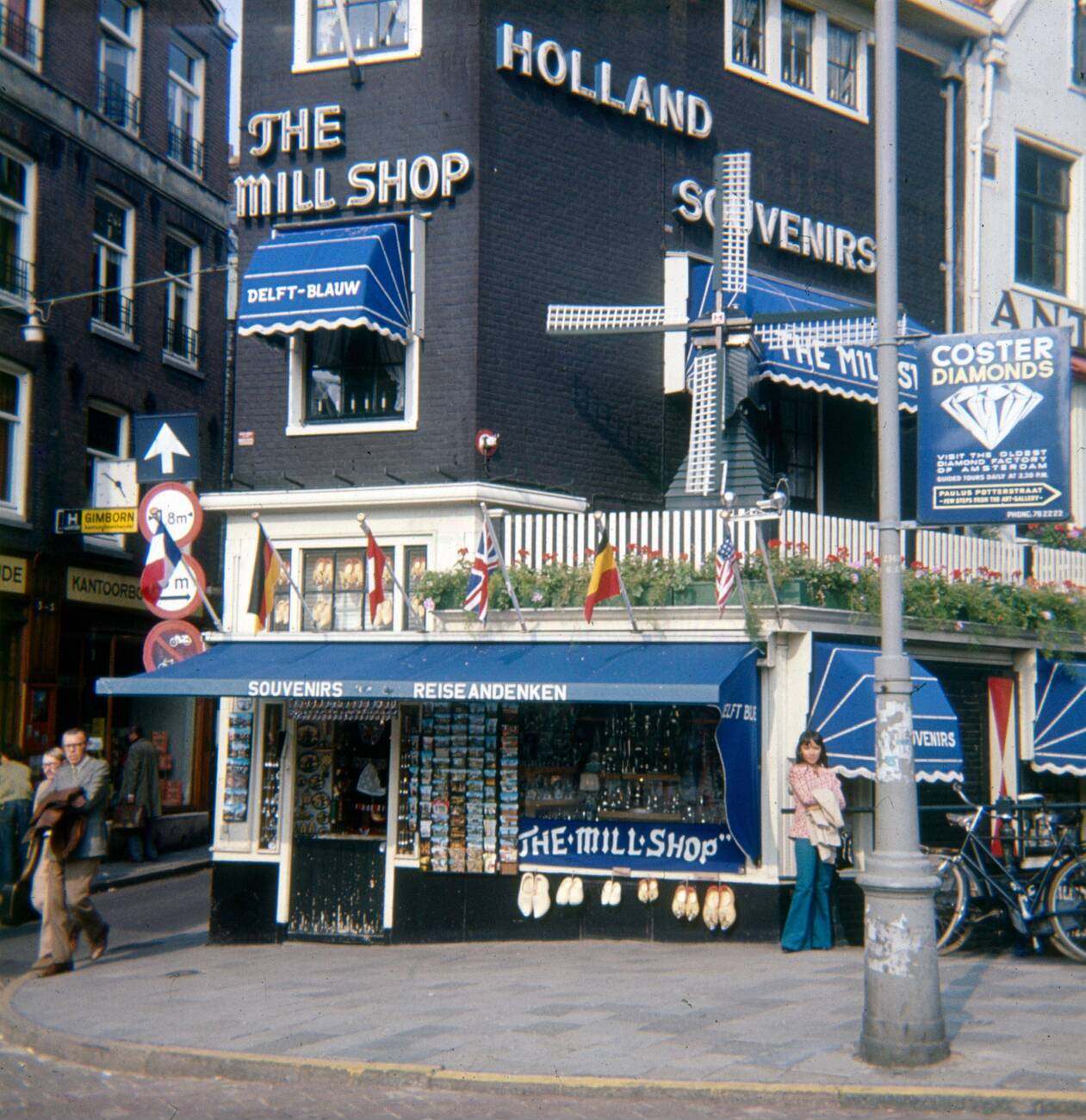 A vintage circa 1972 photograph of The Mill Shop - Holland Souvenirs, located at Rokin 123 in Amsterdam, The Netherlands, near the Oude Turfmarkt (Old Peat Market).