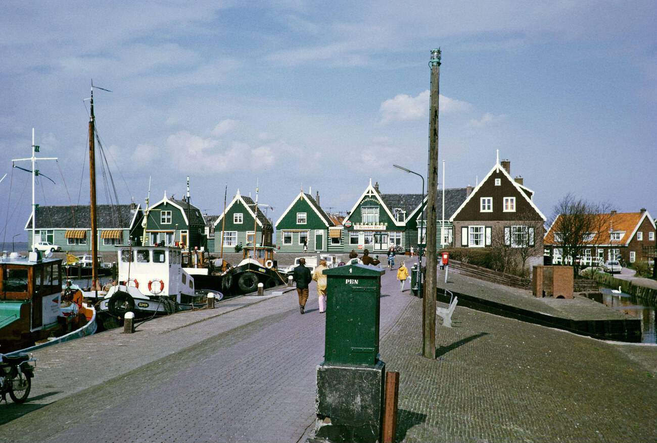 Fishing boats in harbor by traditional village houses, Marken: Traditional village houses and fishing boats in the picturesque harbor of Marken, in 1973.