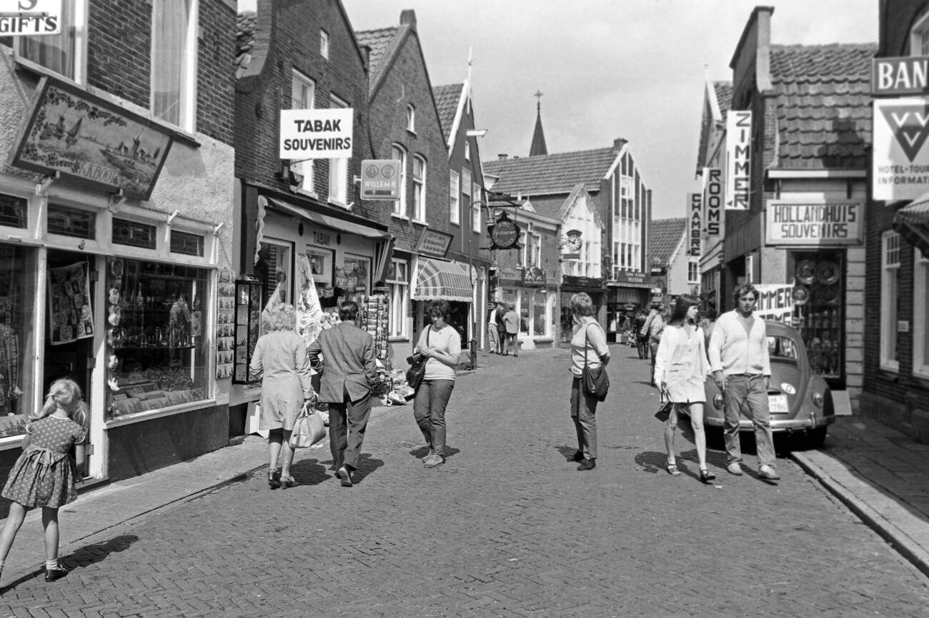 Tourists and passersby in the streets of Monnickendam: A lively scene of tourists and passersby in the streets of Monnickendam, The Netherlands, in 1971.