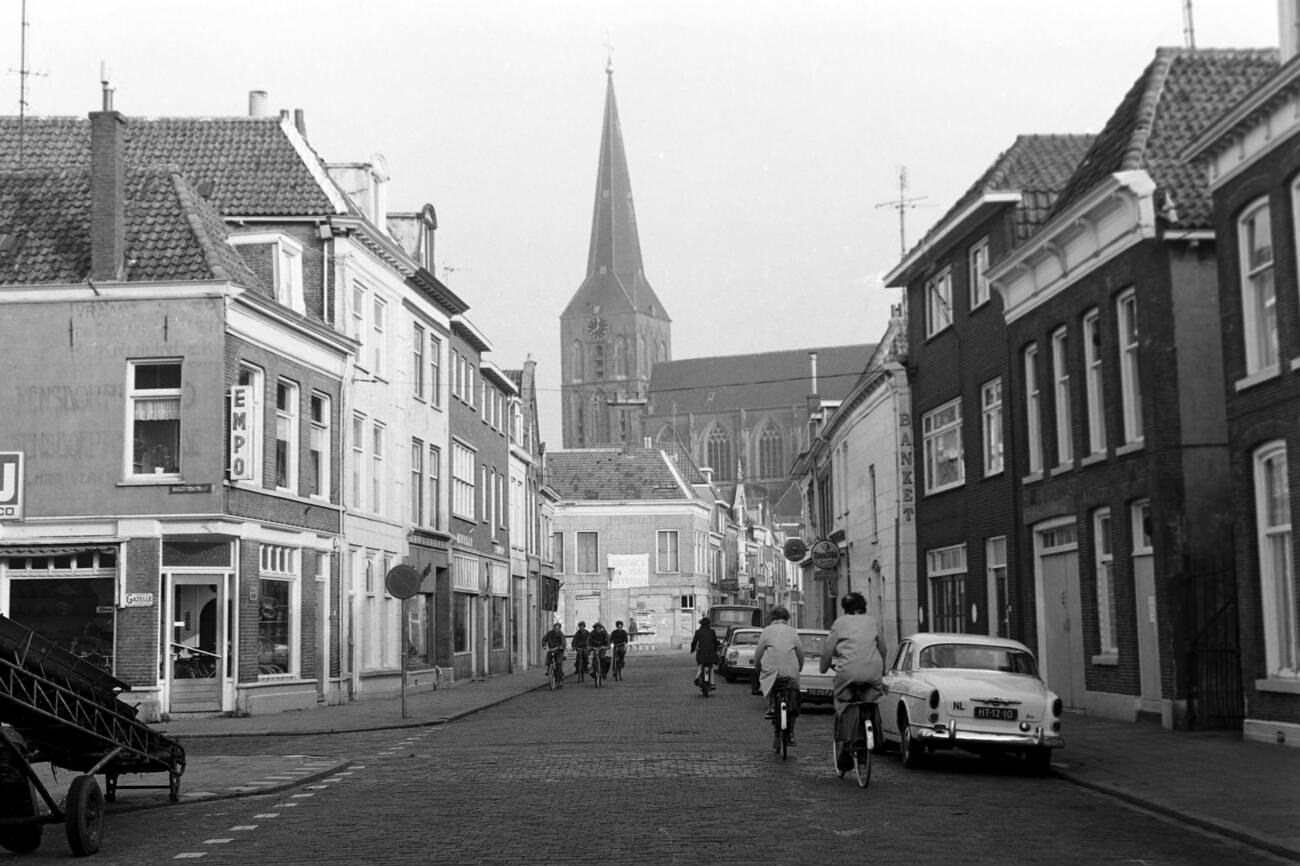 Pedestrians on a street overlooking the Nikolauskirche in Kampen, The Netherlands, in 1971.