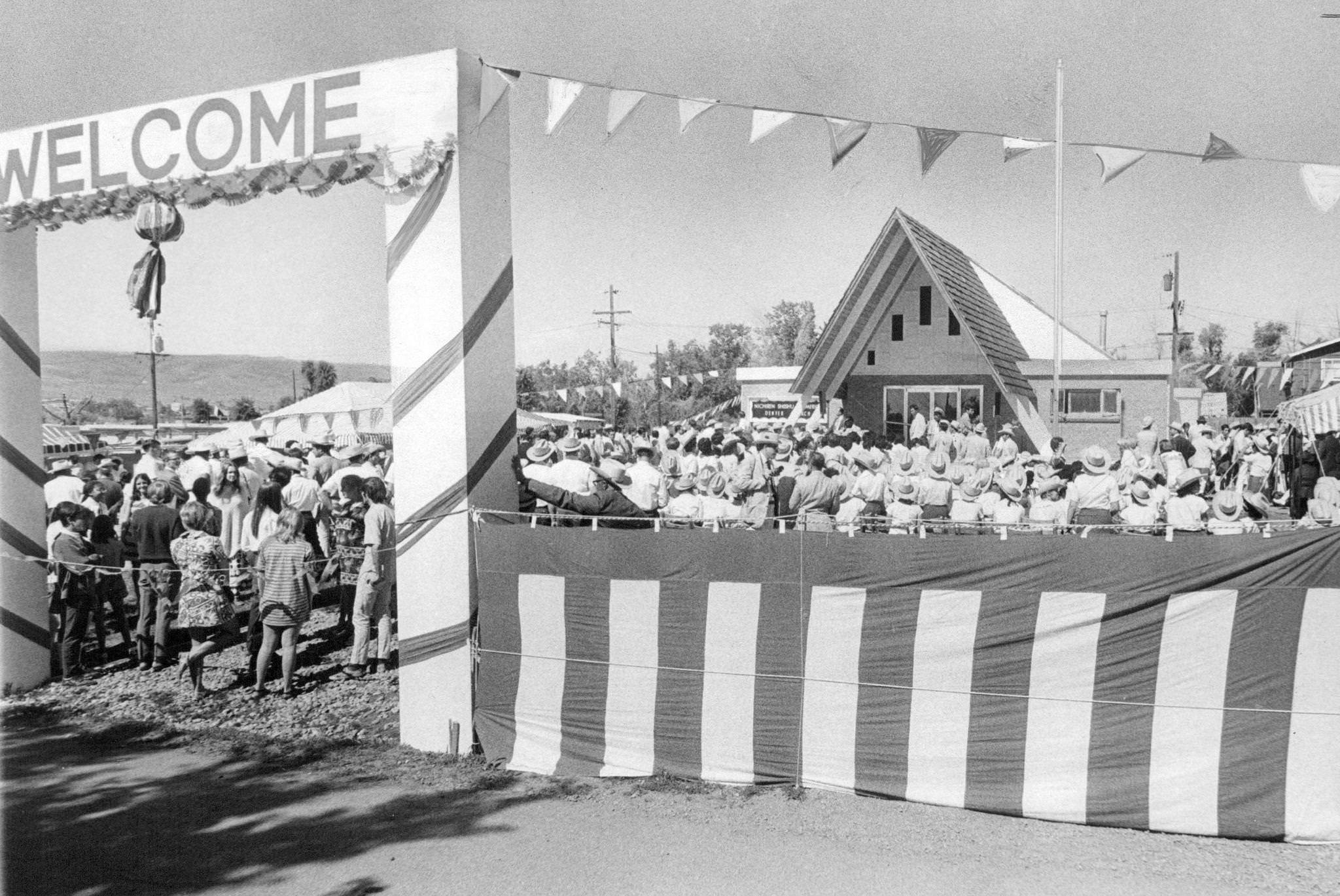 Hundreds welcome opening of new church; those attending the celebration wore cowboy hats, boots, and "sheriff's badges" at the carnival-like event.