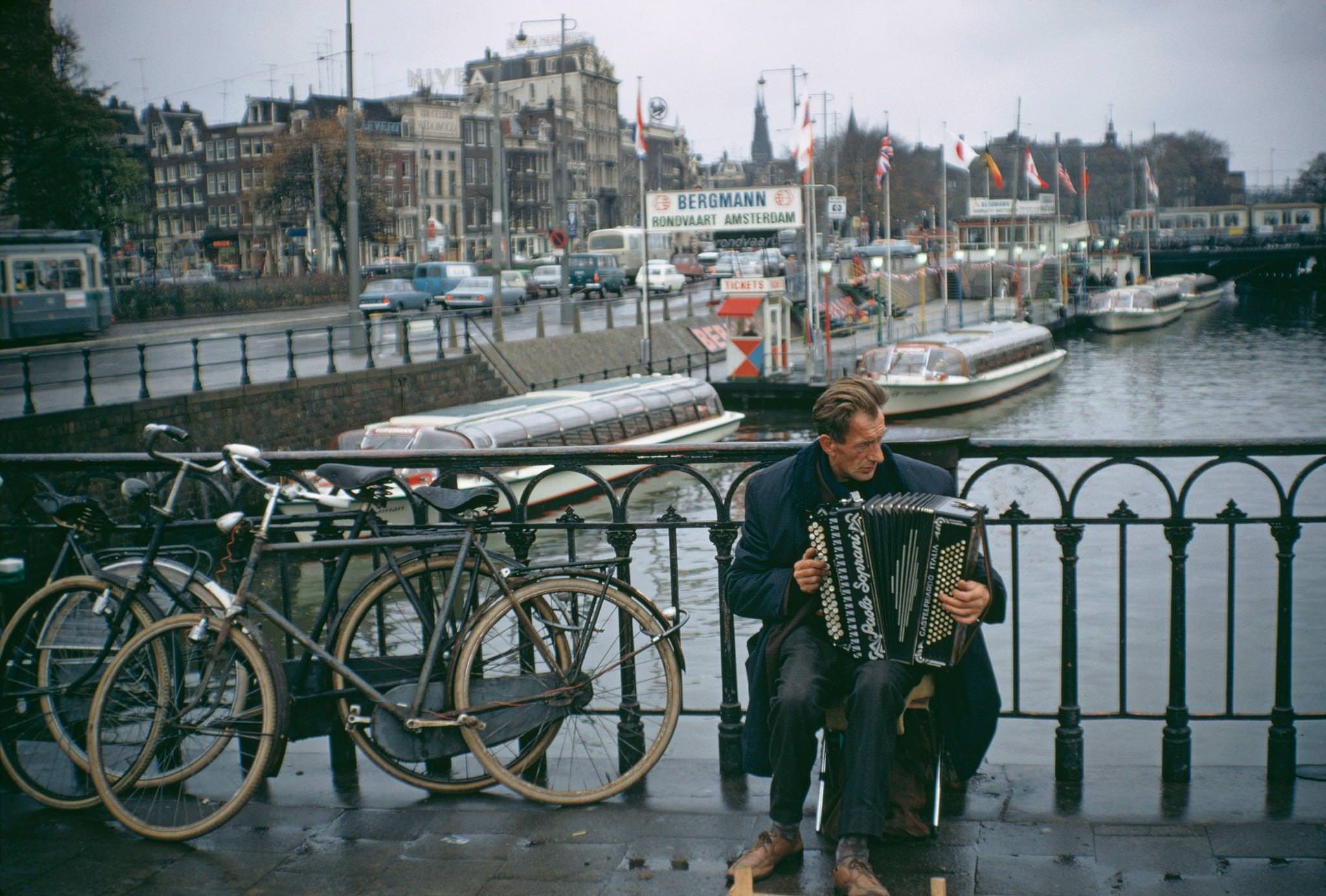 A busker near the Centraal Railway Station in Amsterdam, capital city of the Netherlands, 1970.