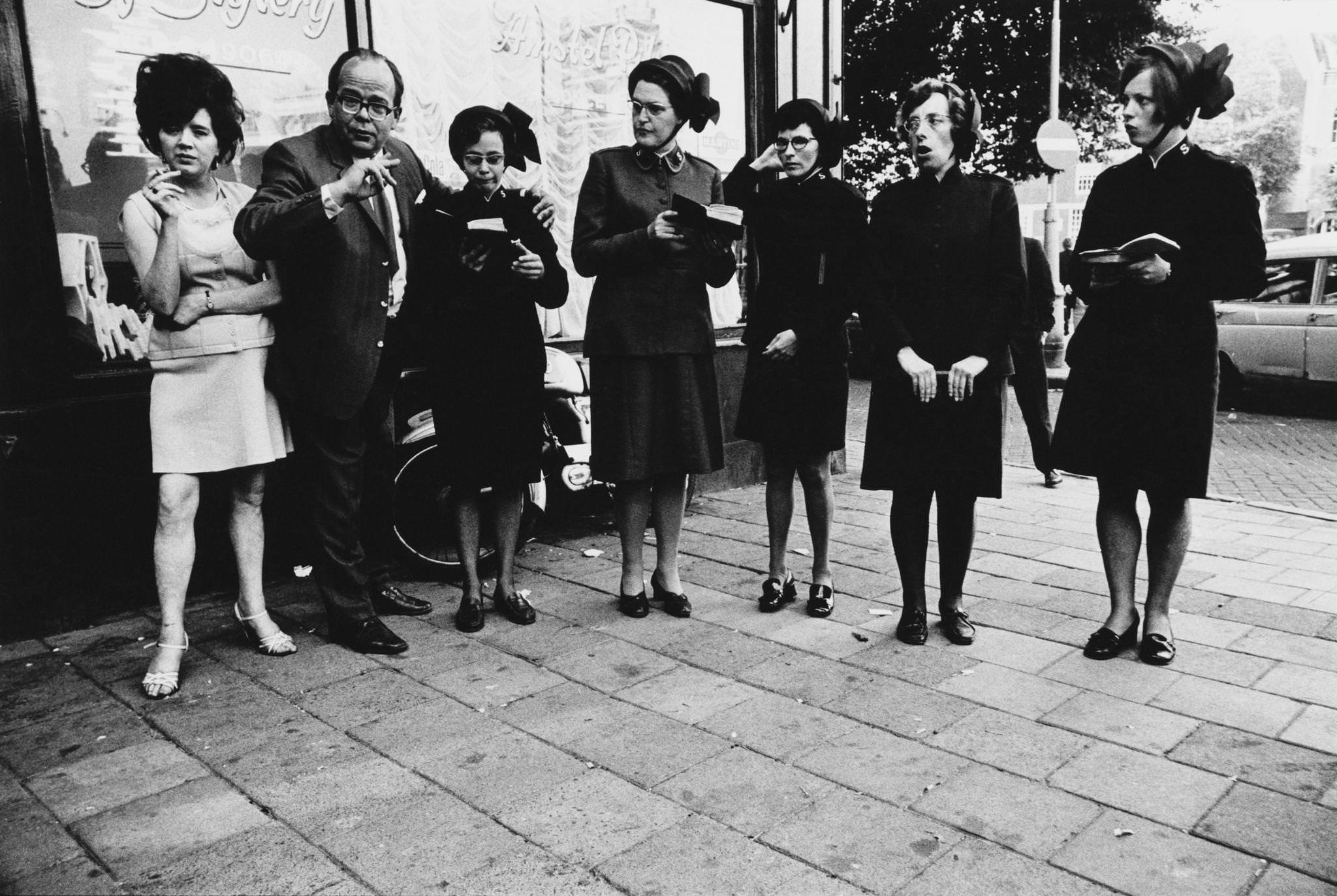 The Salvation Army singing worship songs outside a bar in Amsterdam, capital city of the Netherlands, 1970.