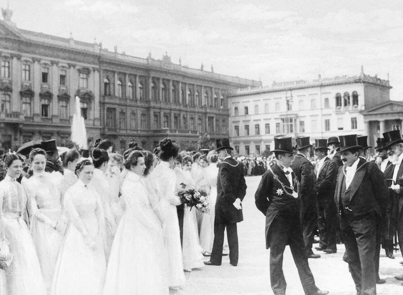 A group of white-clothed "Ehrenjungfrauen" (Ladies of Honour) are awaiting the visit of Queen Wilhelmina of the Netherlands, 1900