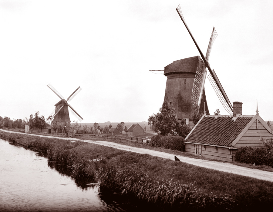 Two windmills along a canal in Landsmeer