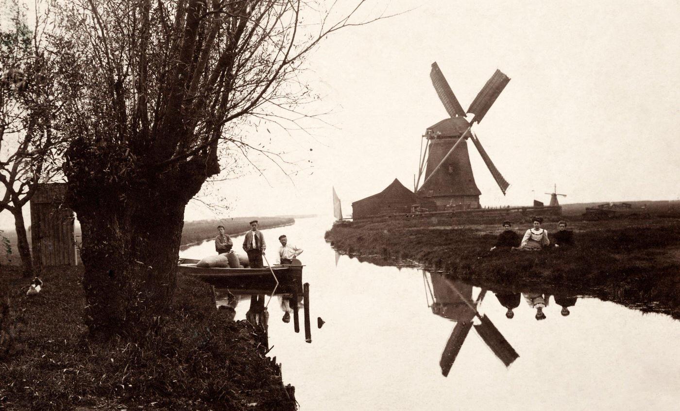 A canal with a windmill in Wormer, north of Amsterdam, Netherlands, 1908