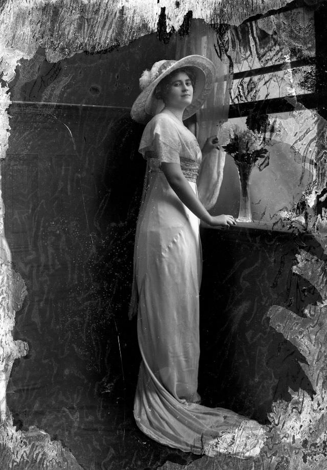 Full-length portrait of a woman in gown, 1905