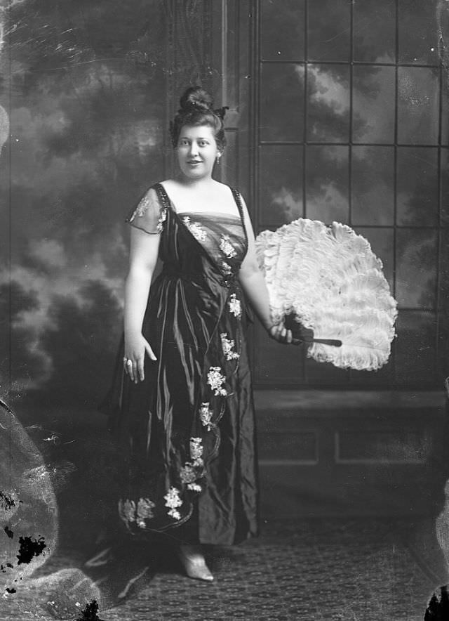 Portrait of a woman holding feather fan, 1905
