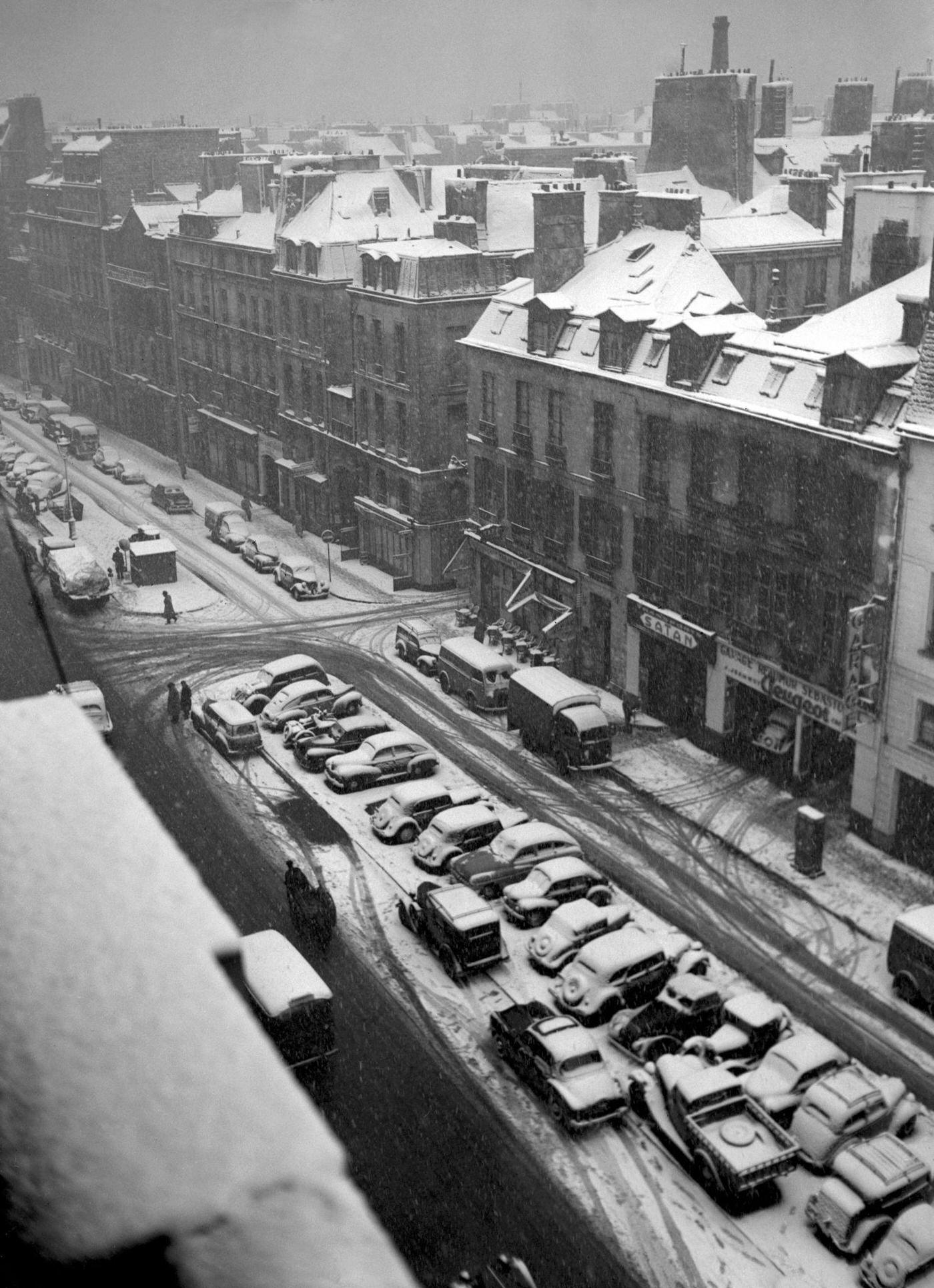 People Walking In The Muddy Snow In Paris During The 1952 Winter.