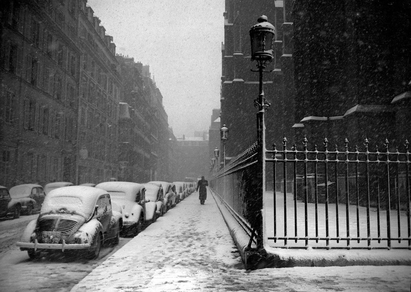 People walking in the muddy snow, 1952