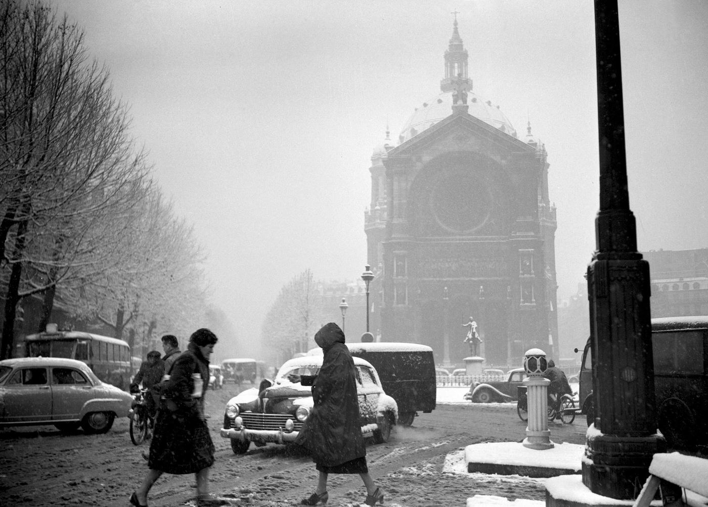 People Walking In The Muddy Snow In Paris During The 1952 Winter.