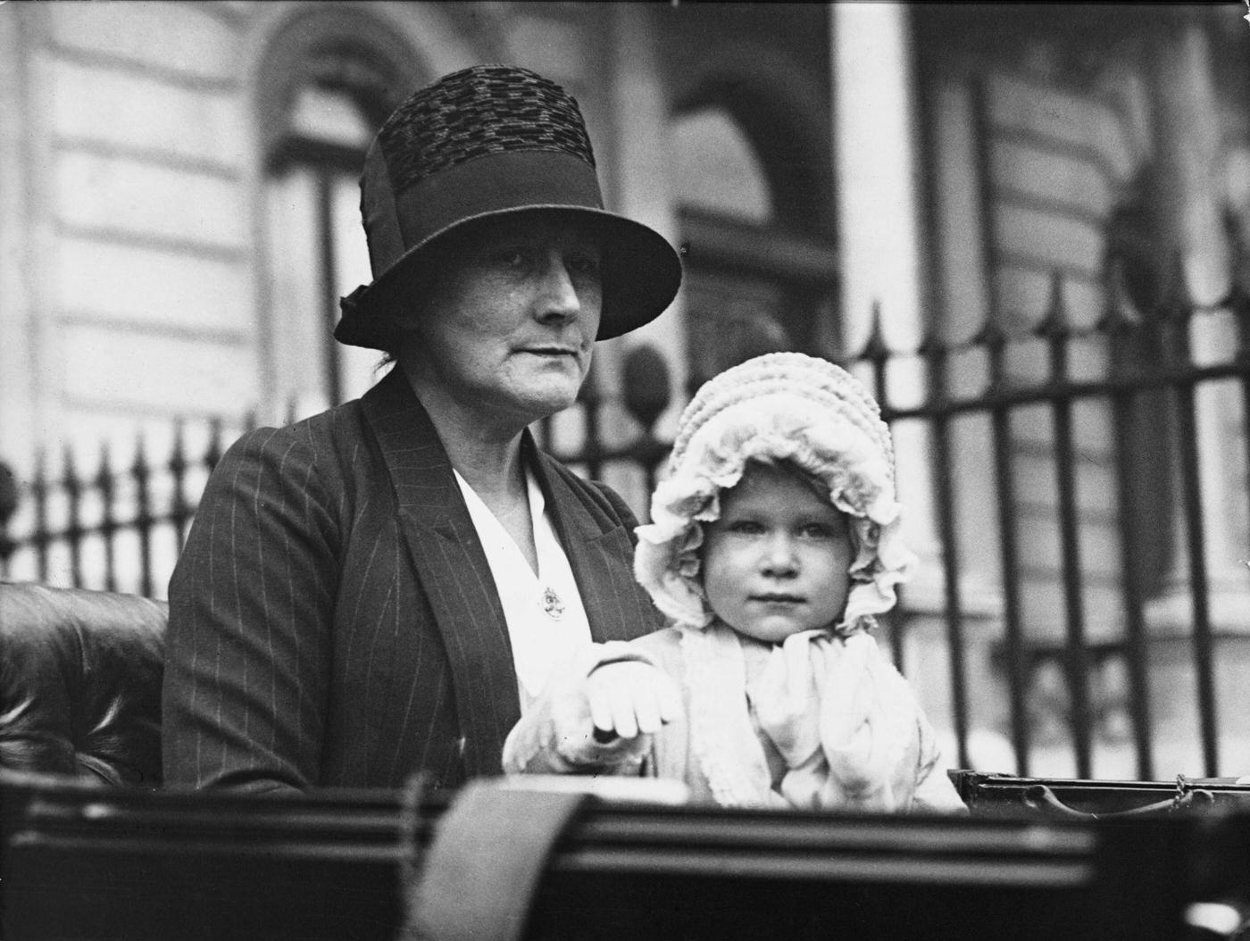 Princess Elizabeth and her nanny Clara Knight, seated together in a carriage for a drive from the Duke of York's house in Piccadilly, London, 1928.