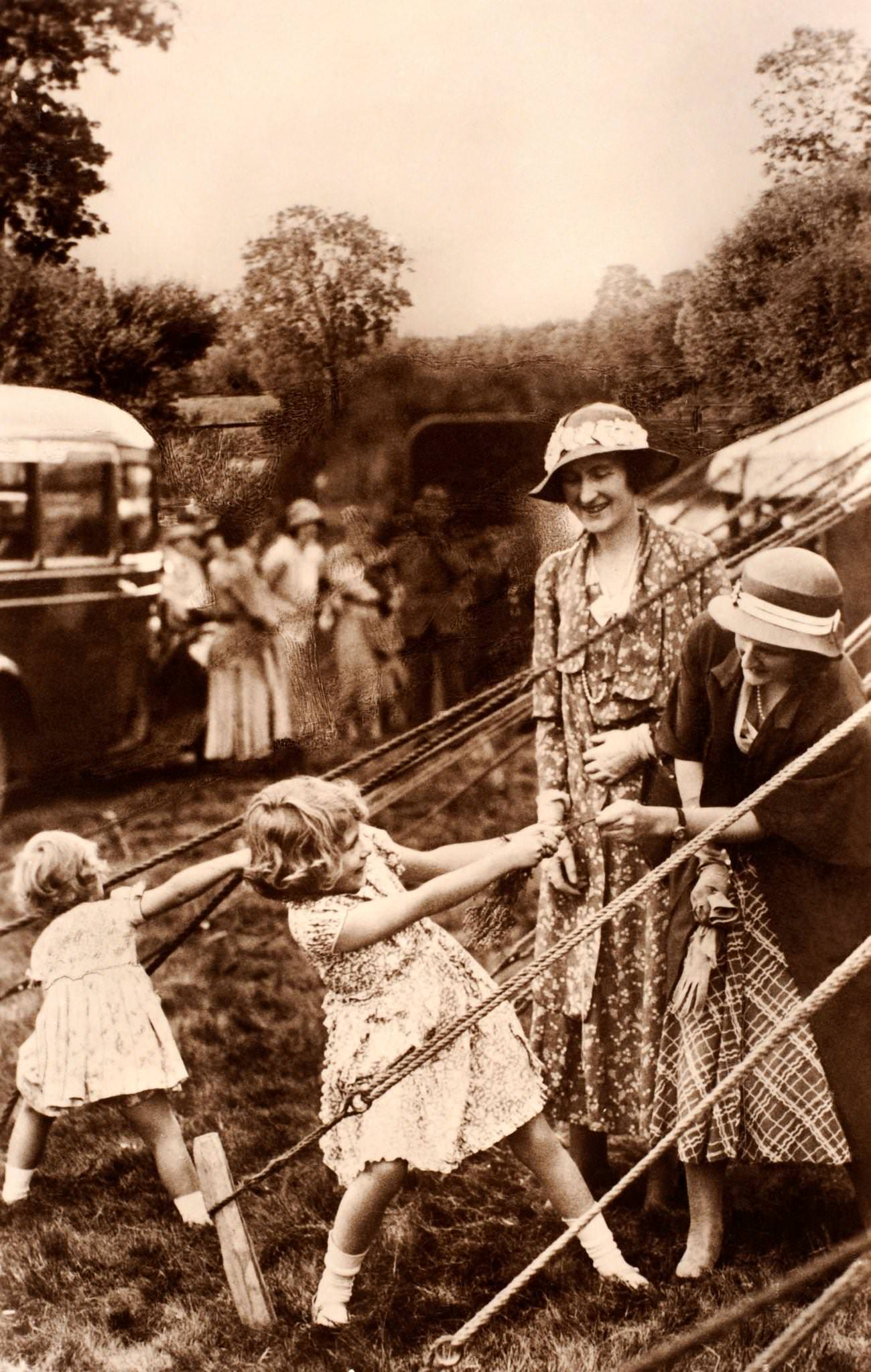 Princess Elizabeth and her sister Margaret Rose at play, circa 1931.