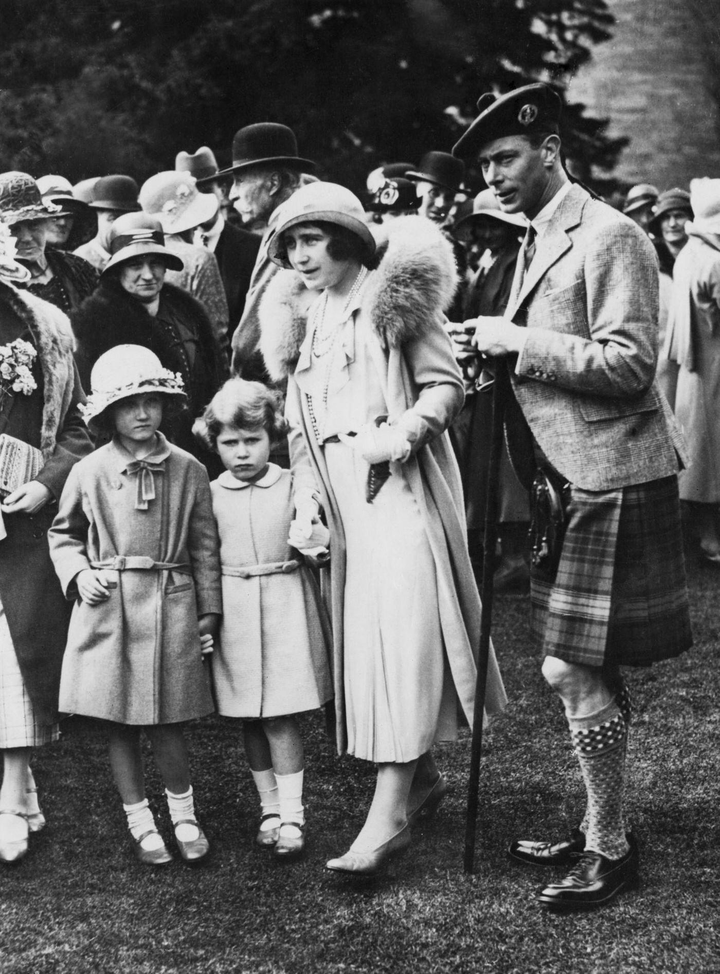 The Duke and Duchess of York, attend a garden party at Glamis Castle in Angus, Scotland, August 1931. With them are their daughters Princess Elizabeth (later Queen Elizabeth II) and their niece Diana Bowes-Lyon.