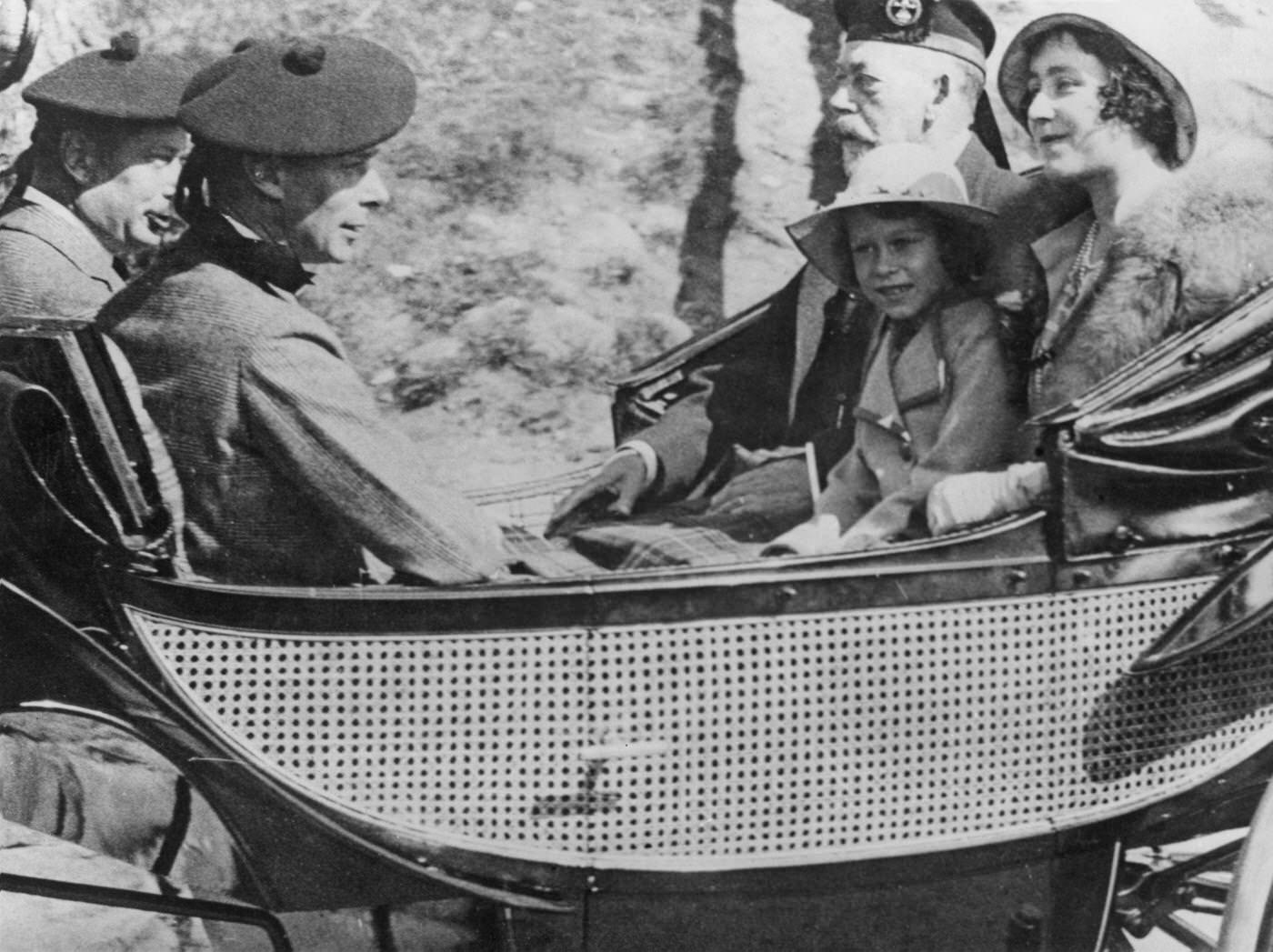 Queen Elizabeth II in a carriage with King George V and her parents, the Duke and Duchess of York (later King George VI and Queen Elizabeth), 1933.
