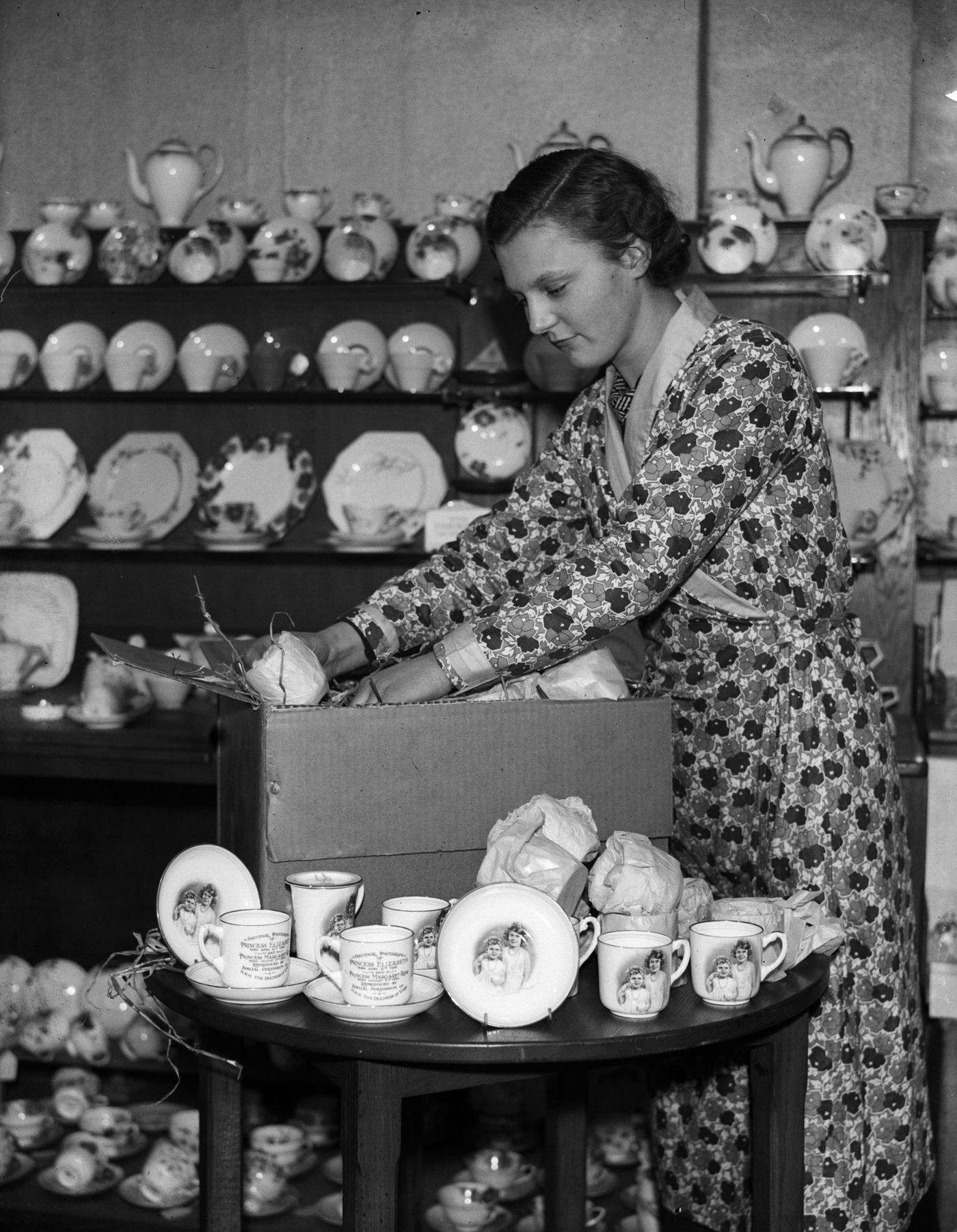 Woman Packs Cups and Saucers with Portraits of Princess Elizabeth and Margaret, 20th December 1933
