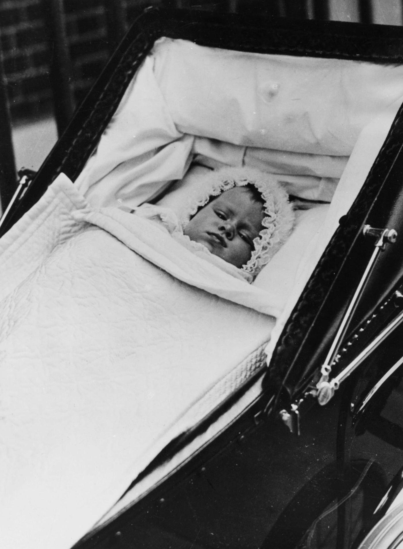 Childhood portrait of Queen Elizabeth II lying in her pram, 1926.