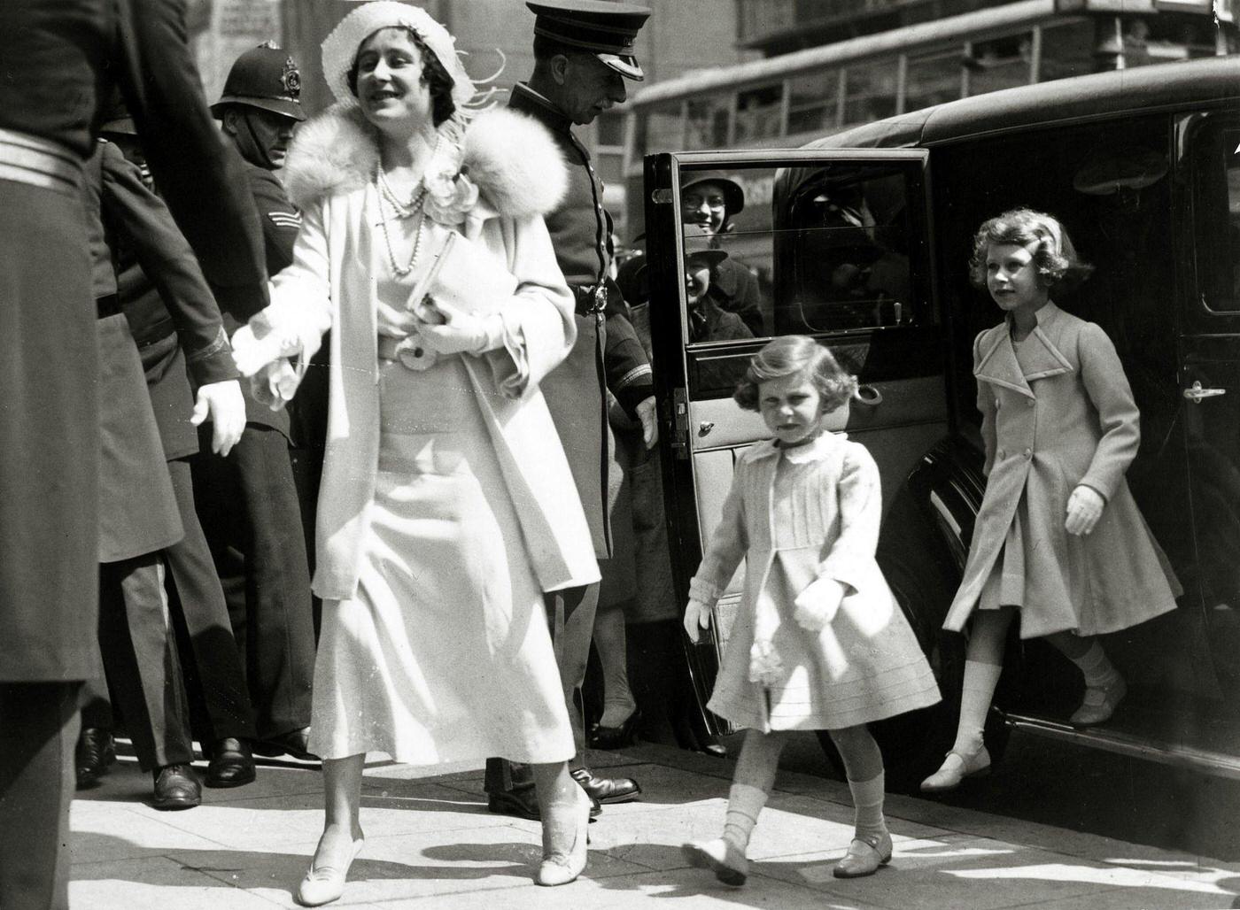 The Duchess of York with her children Princess Margaret and Princess Elizabeth arriving at the Royal Tournament at Olympia, London.