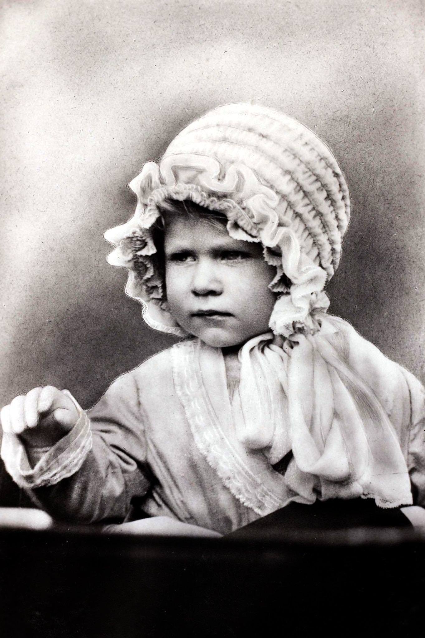 Princess Elizabeth wearing a cute bonnet, daughter of The Duke and Duchess of York, 1927.