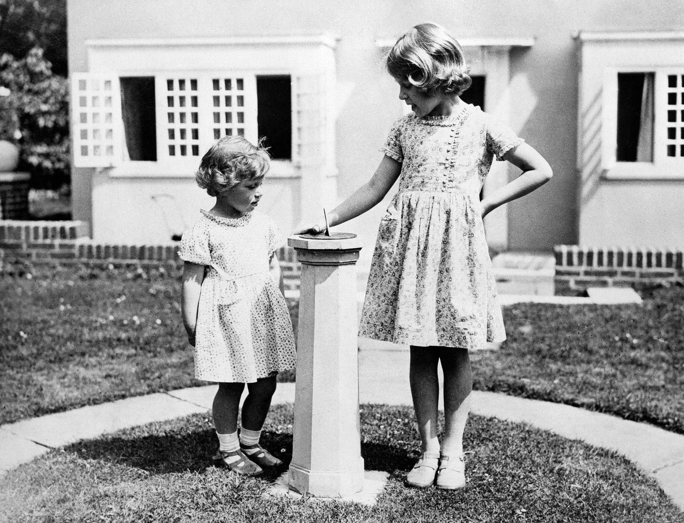 King George VI and Queen Elizabeth with Princess Elizabeth and Princess Margaret, 1937.