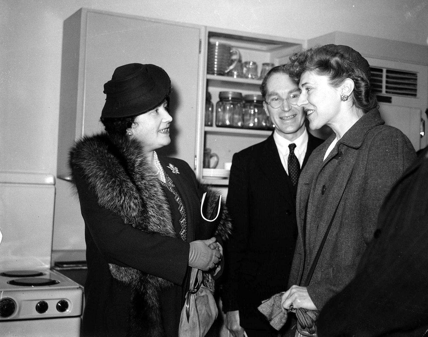 Queen Elizabeth at the Planning Exhibition, 1945, London, England, inspects an exhibit.