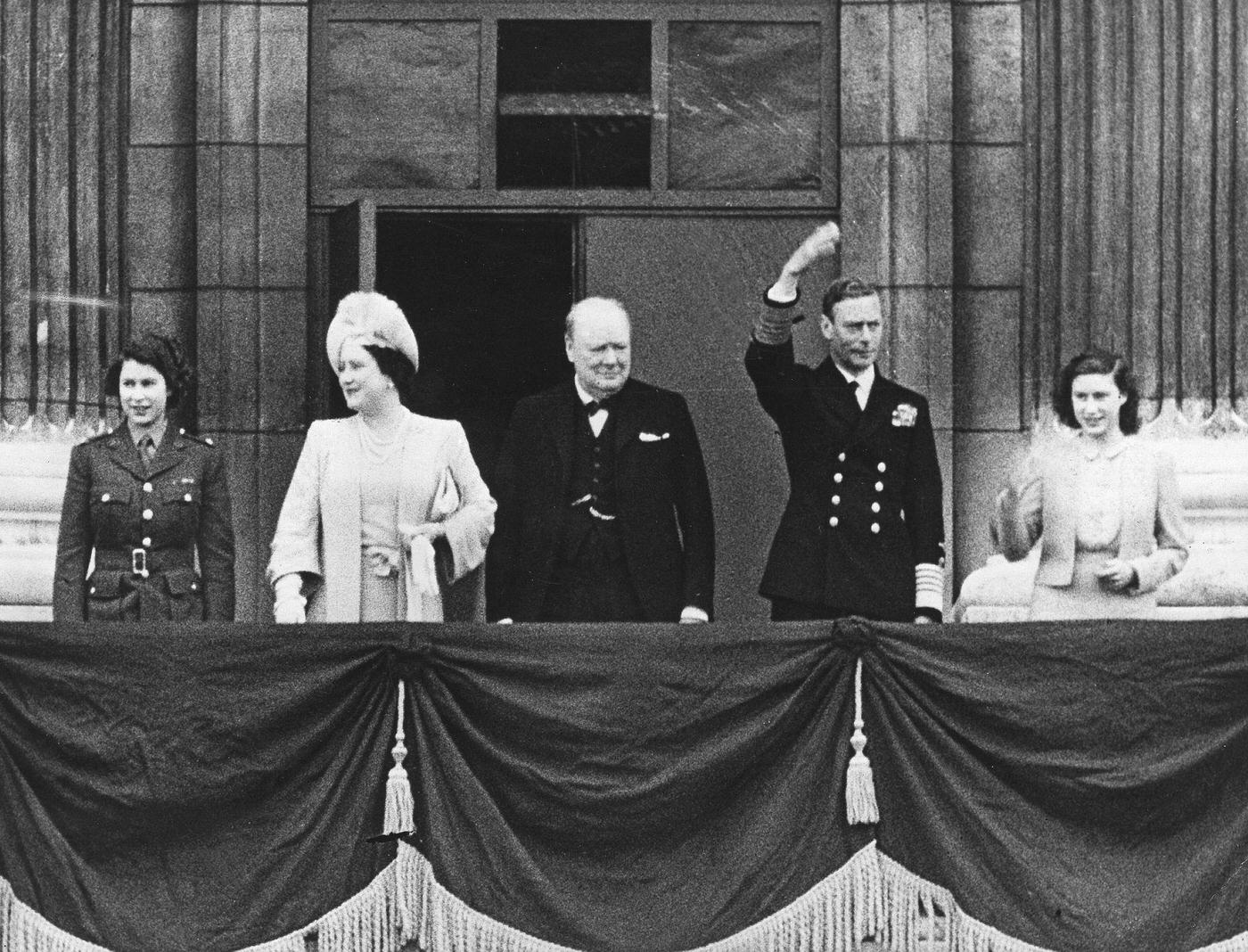 King George VI, Queen Elizabeth, Princess Elizabeth, and Princess Margaret at the Victory in Europe Day celebrations, 1945