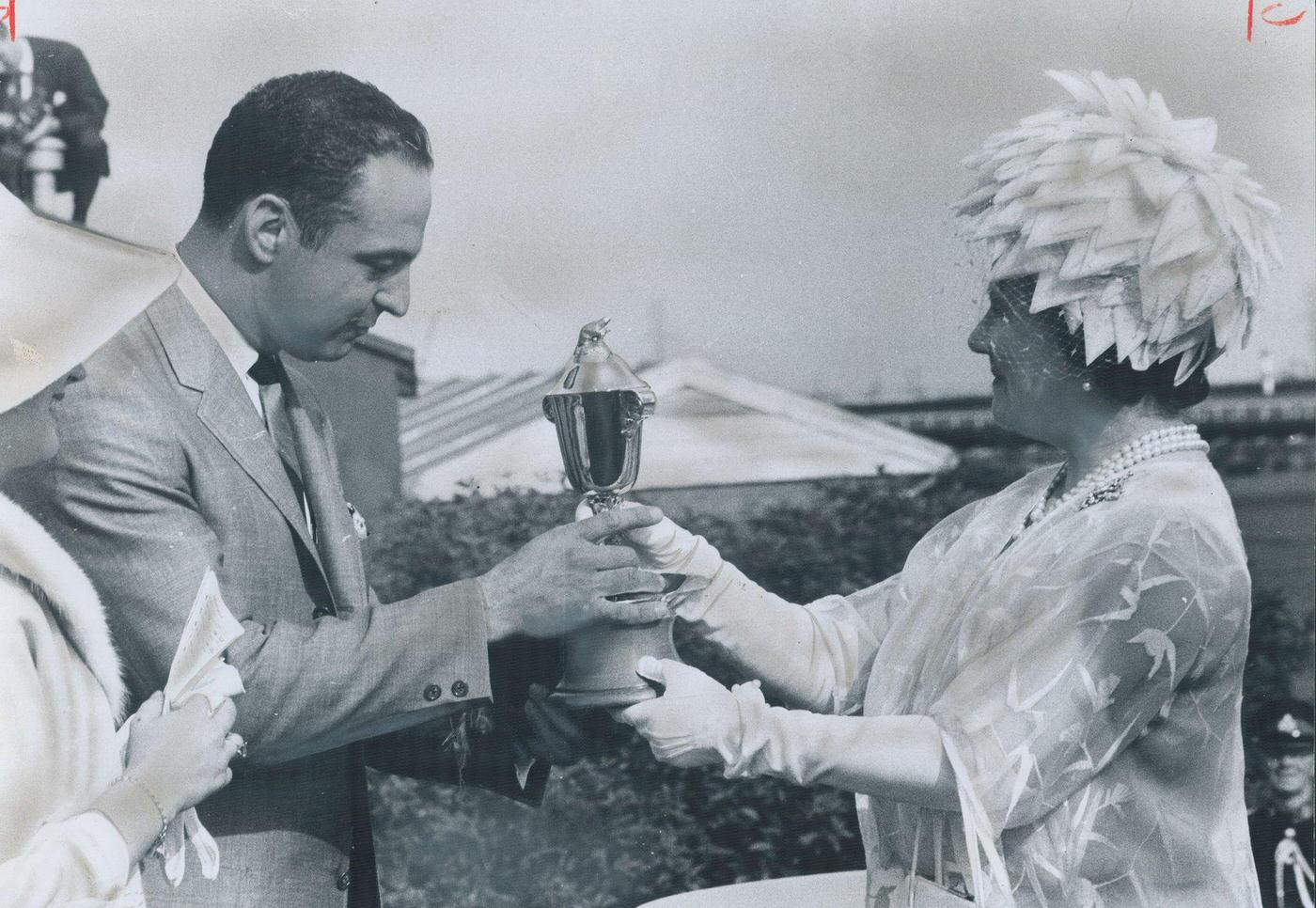 Queen's Plate trophy for winning colt Whistling Sea was presented to Calgary owner Paul Olivier by the Queen Mother in Canada, 1974.