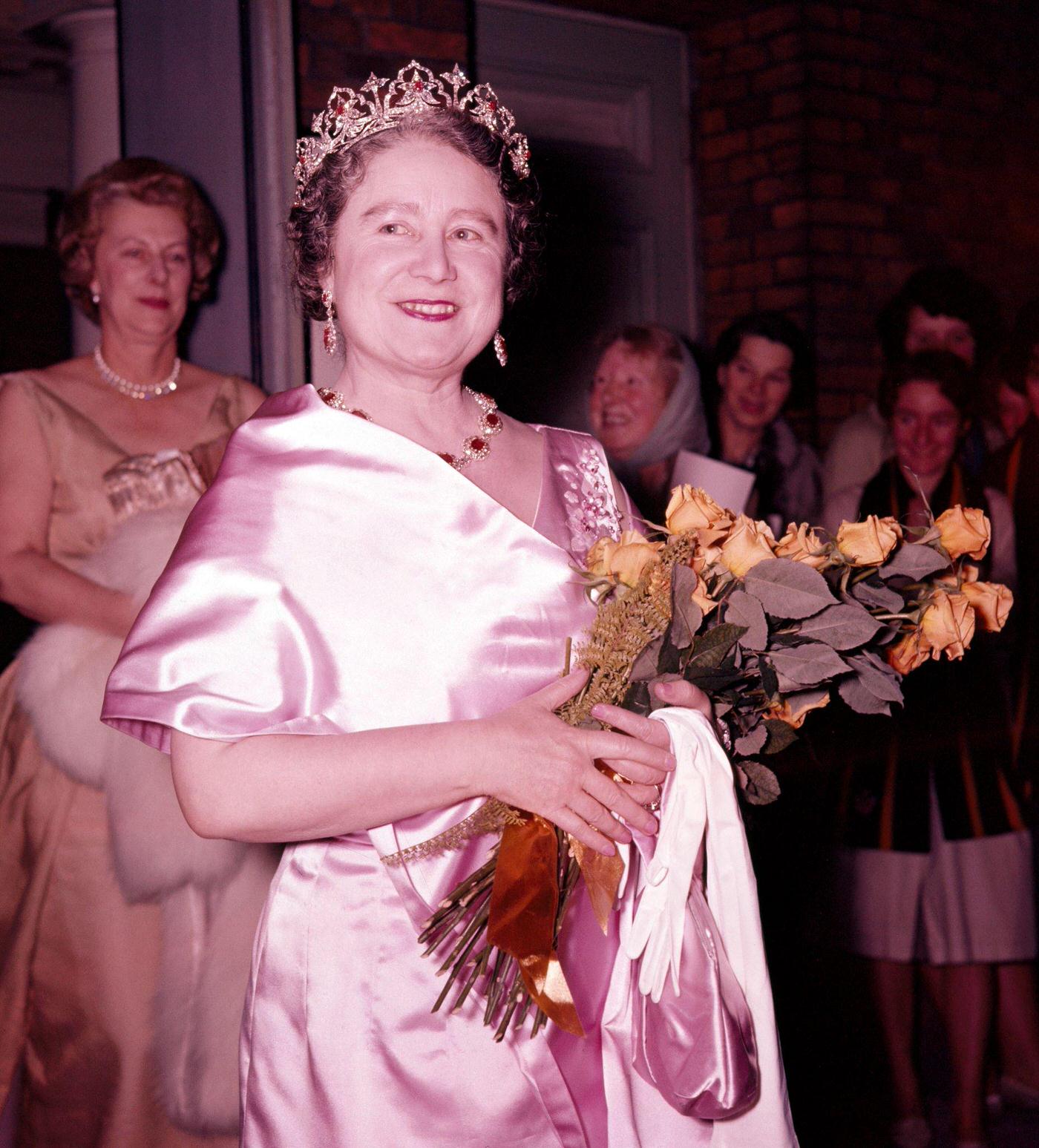 Queen Elizabeth, The Queen Mother, attending a theatrical performance in London, 1960.