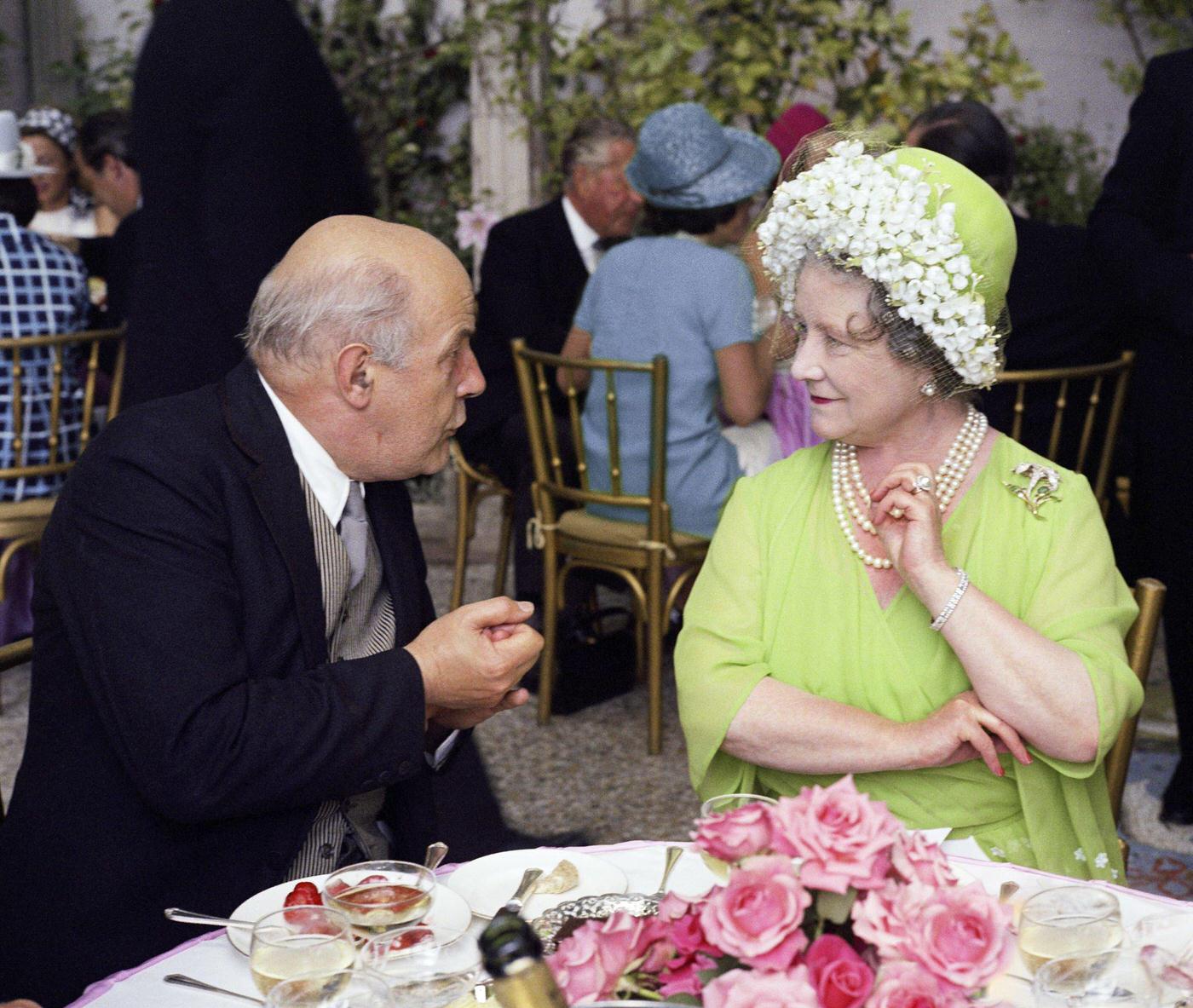 Queen Elizabeth The Queen Mother and poet John Betjeman at the wedding of Sheran Cazalet and Simon Hornby at Fairlawn in Sussex, 1968.