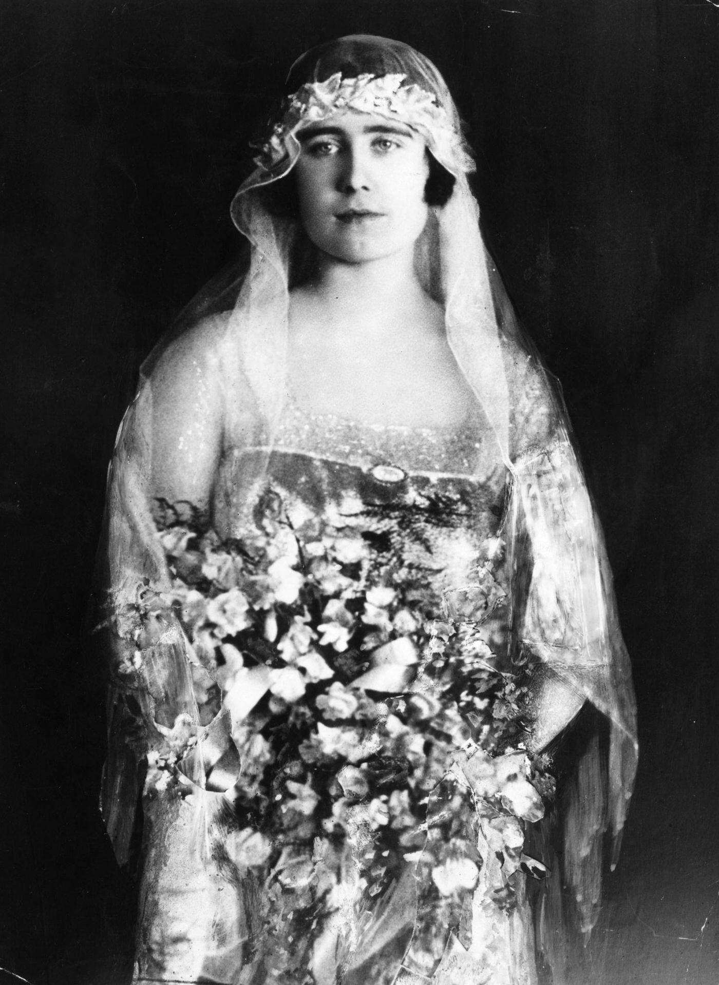 Lady Elizabeth Bowes-Lyon dressed as a bridesmaid to Princess Mary, Countess of Harewood, 1922.