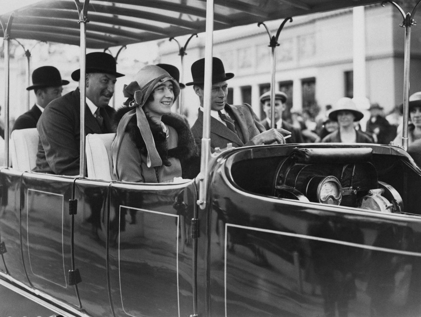 The Duke and Duchess of York take a ride on a 'Railodok' electric car at the British Empire Exhibition, Wembley, London, 29th May 1925.