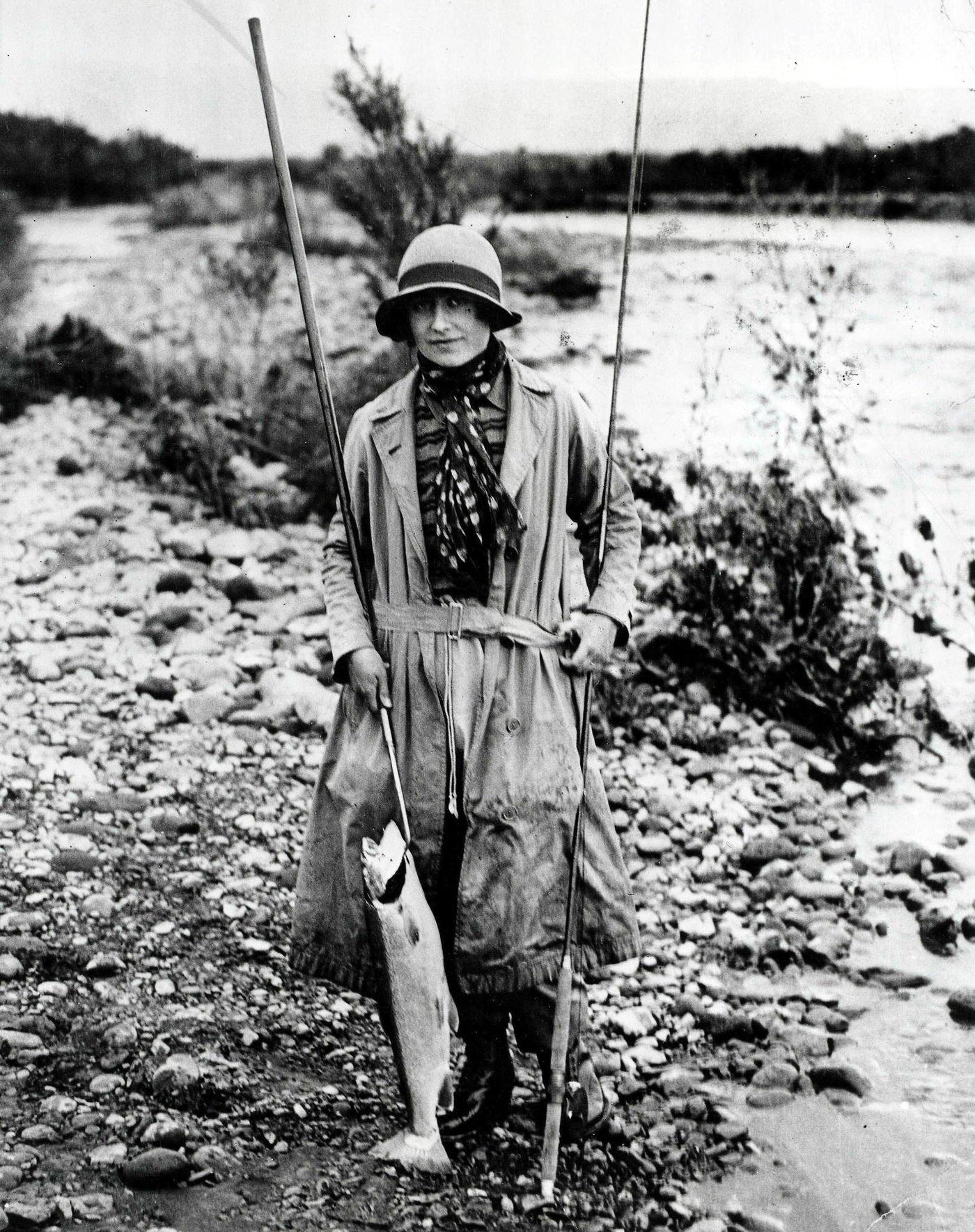 Queen Mother Fishing: Royal tour of Australia and New Zealand, 1927, the Queen Mother, then the Duchess of York, holding a salmon she had caught after a fishing expedition at Tokaanu, New Zealand.