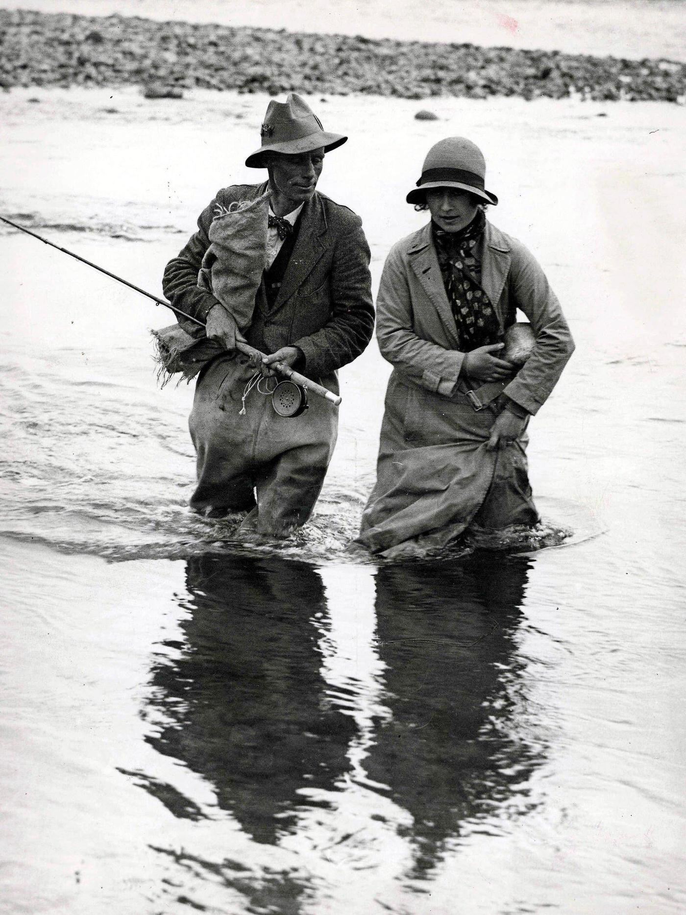 The Queen Mother fishing for trout during a fishing expedition at Tokaanu, New Zealand.