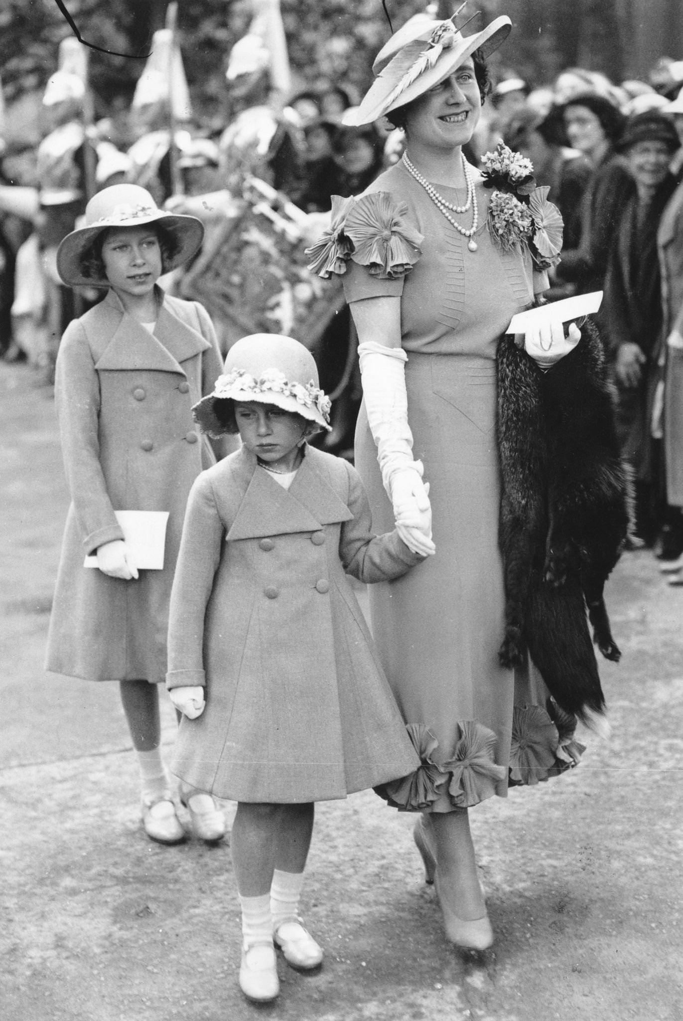 Elizabeth, Duchess of York with Princesses Elizabeth and Margaret arriving at Glamis Castle, Angus, to present Colours to the 4th and 5th Black Watch Regiments, 1935.