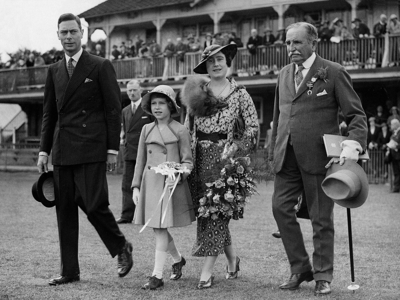Queen Elizabeth II with King George VI and Queen Elizabeth at a children's horse race, 1936.