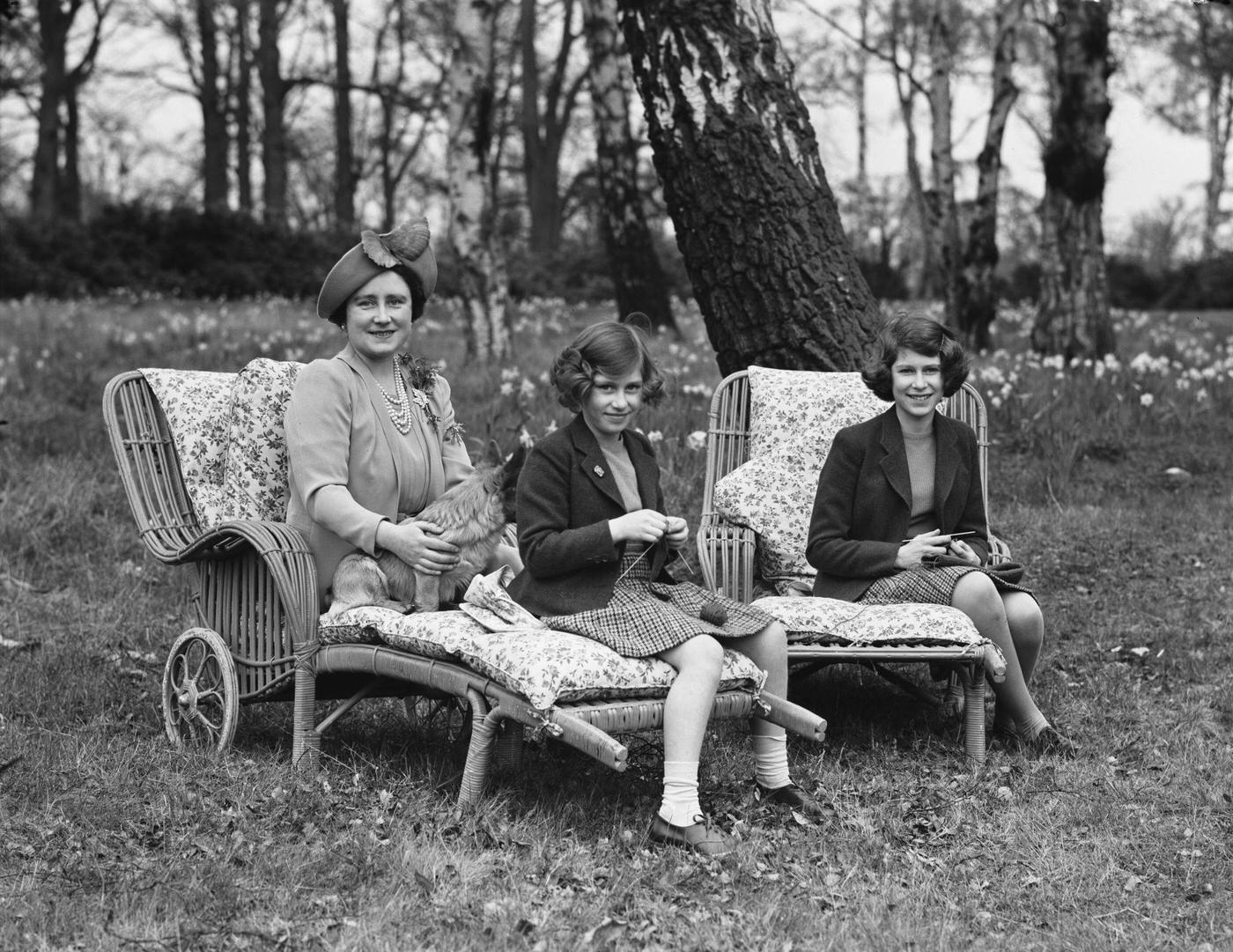 Princesses Elizabeth and Margaret with Queen Elizabeth and a Pembroke Welsh Corgi dog at Royal Lodge, Windsor Great Park, 1940.