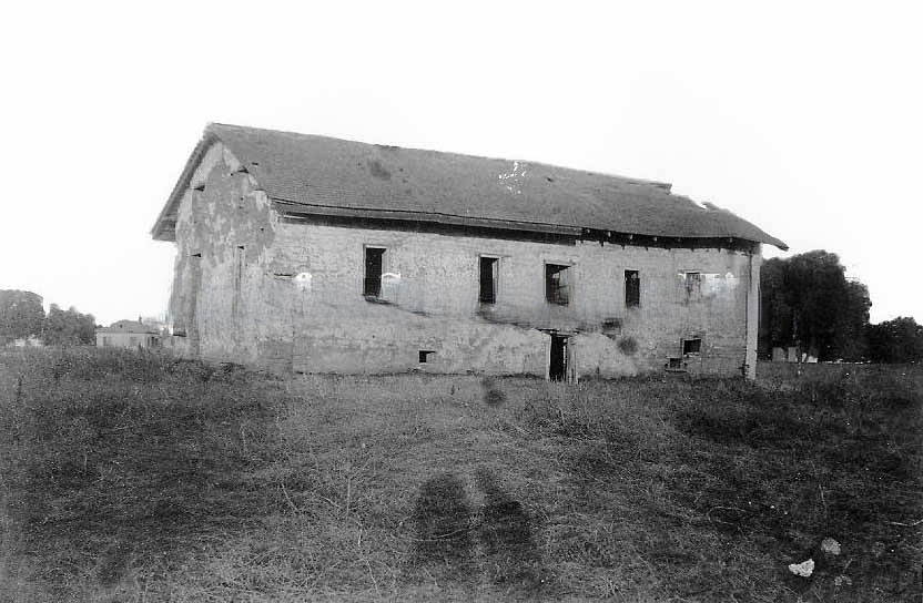 View of the central building at Sutter's Fort before restoration, 1890