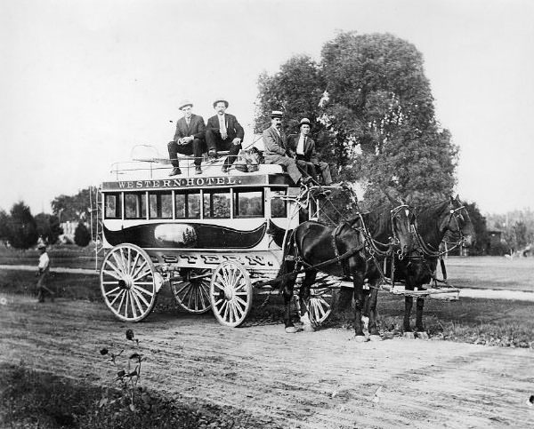 Exterior view of the Western Hotel's horse-drawn passenger wagon, 1890s.