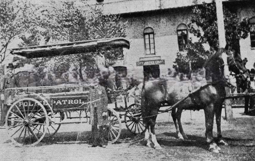 City Police Patrol wagon in front of the City Jail and City Justice Court in the old City Hall at Front and I Streets, 1890